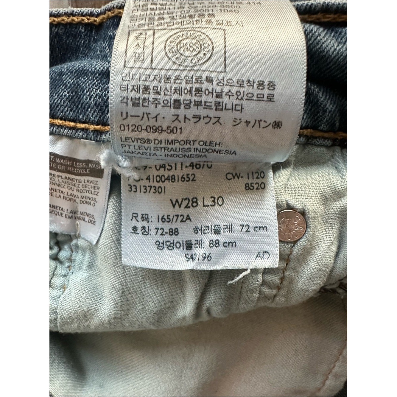 Upcycled Levi’s 511 Cut Off Shorts with Embroidered Pockets. Size 28; Runs Small