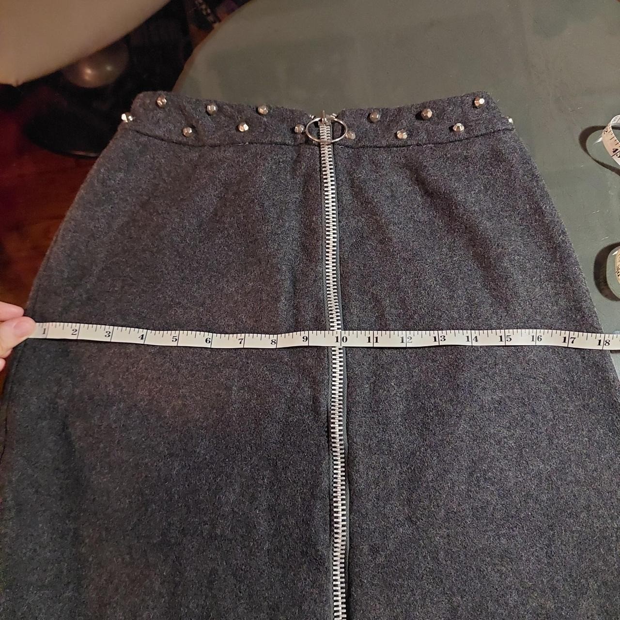 Vintage dark grey mini skirt with metal zipper and metal stud details.