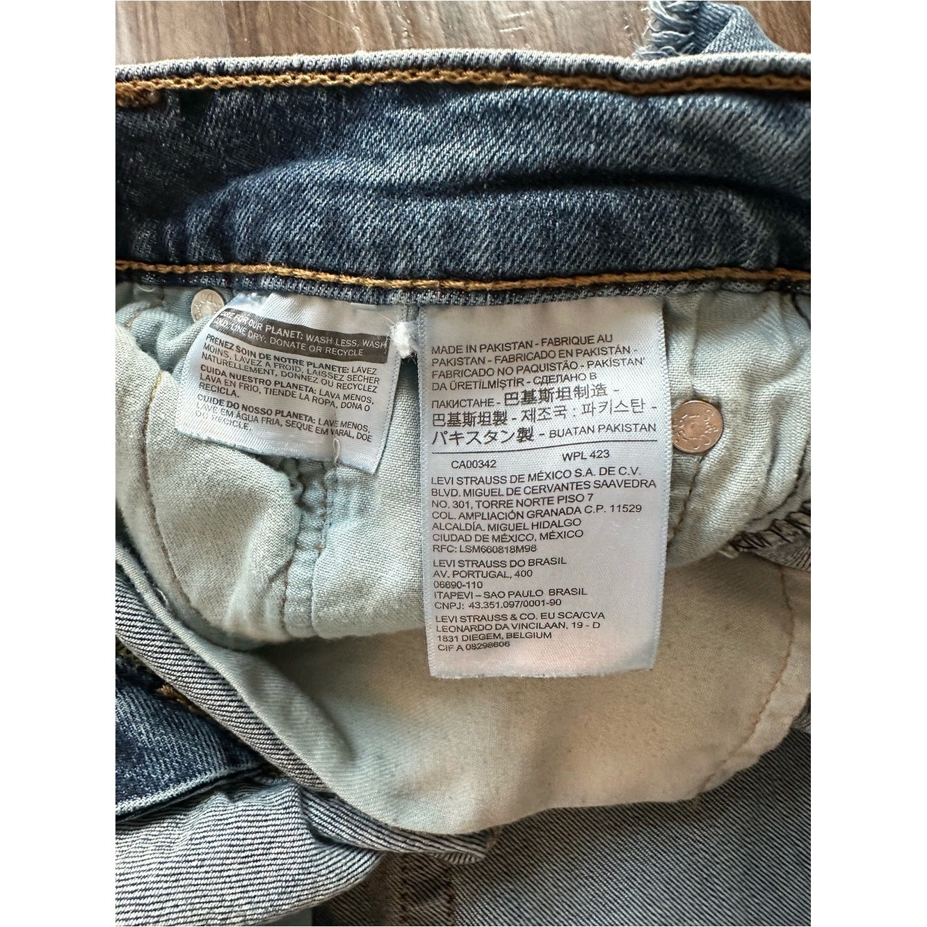 Upcycled Levi’s 511 Cut Off Shorts with Embroidered Pockets. Size 28; Runs Small