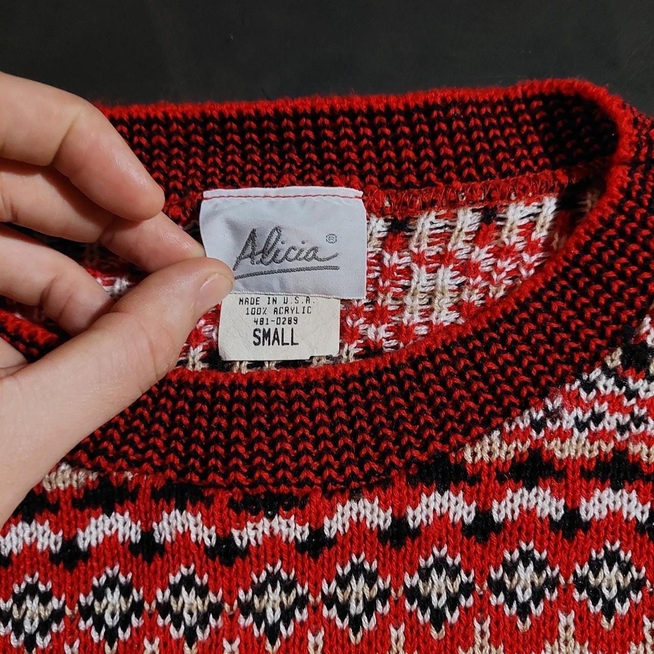 Vintage red, black, white, and tan geometric patterned sweater vest.
