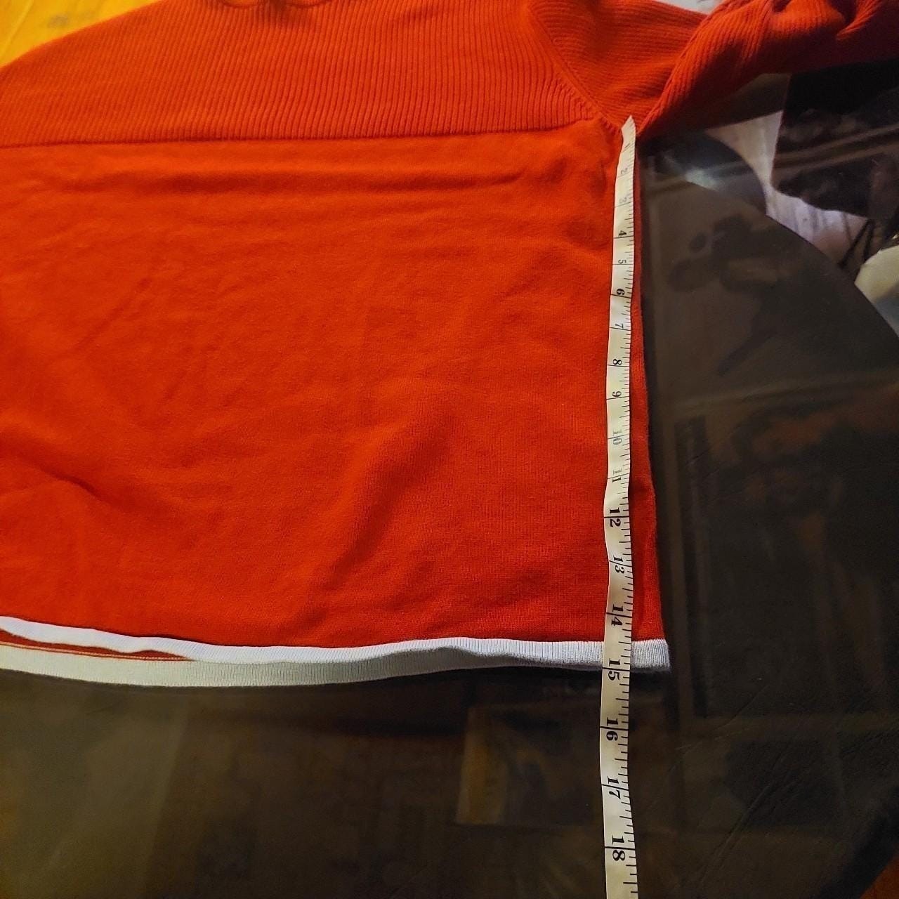 Vintage red sweater with a light blue detailing on the hemline and sleeves.