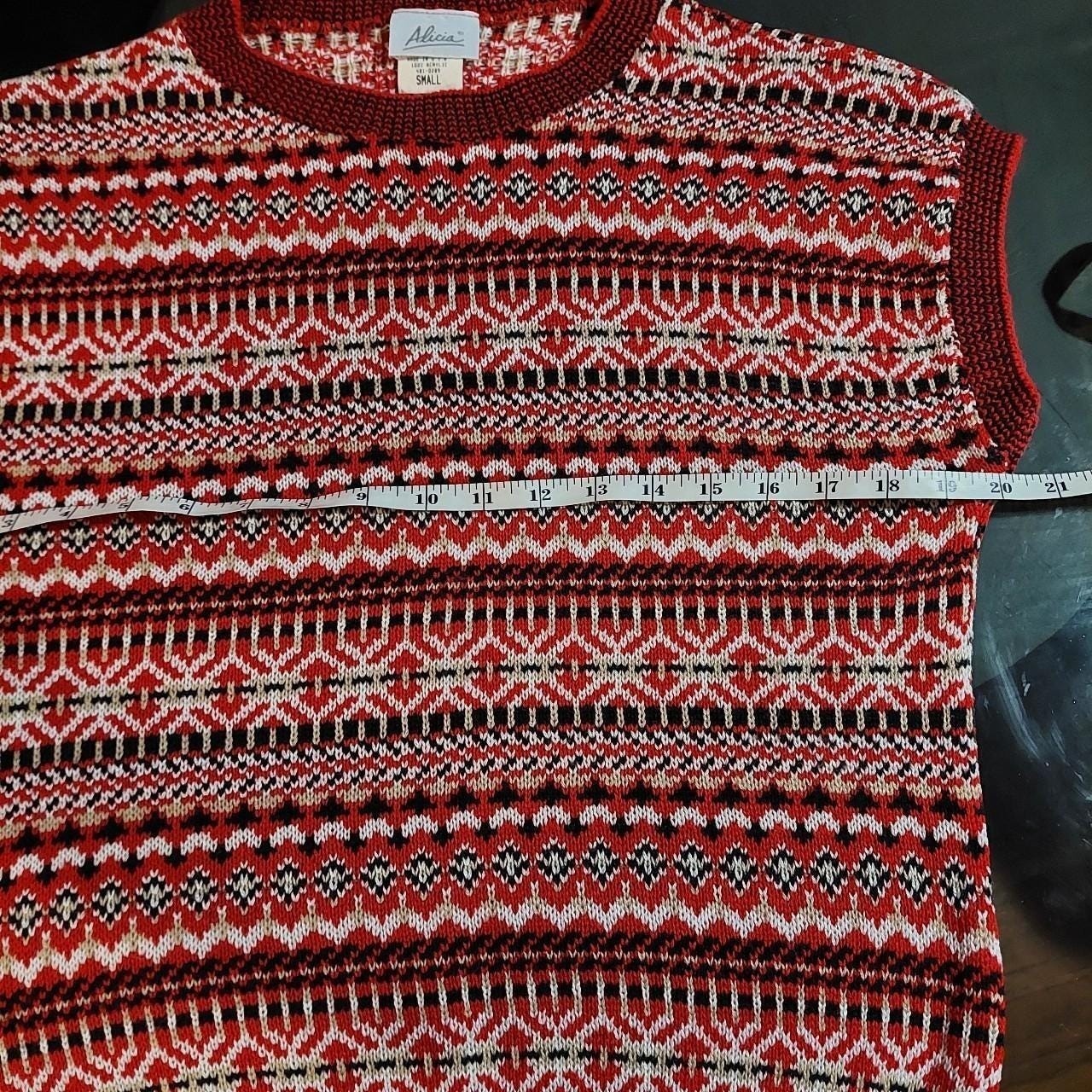 Vintage red, black, white, and tan geometric patterned sweater vest.
