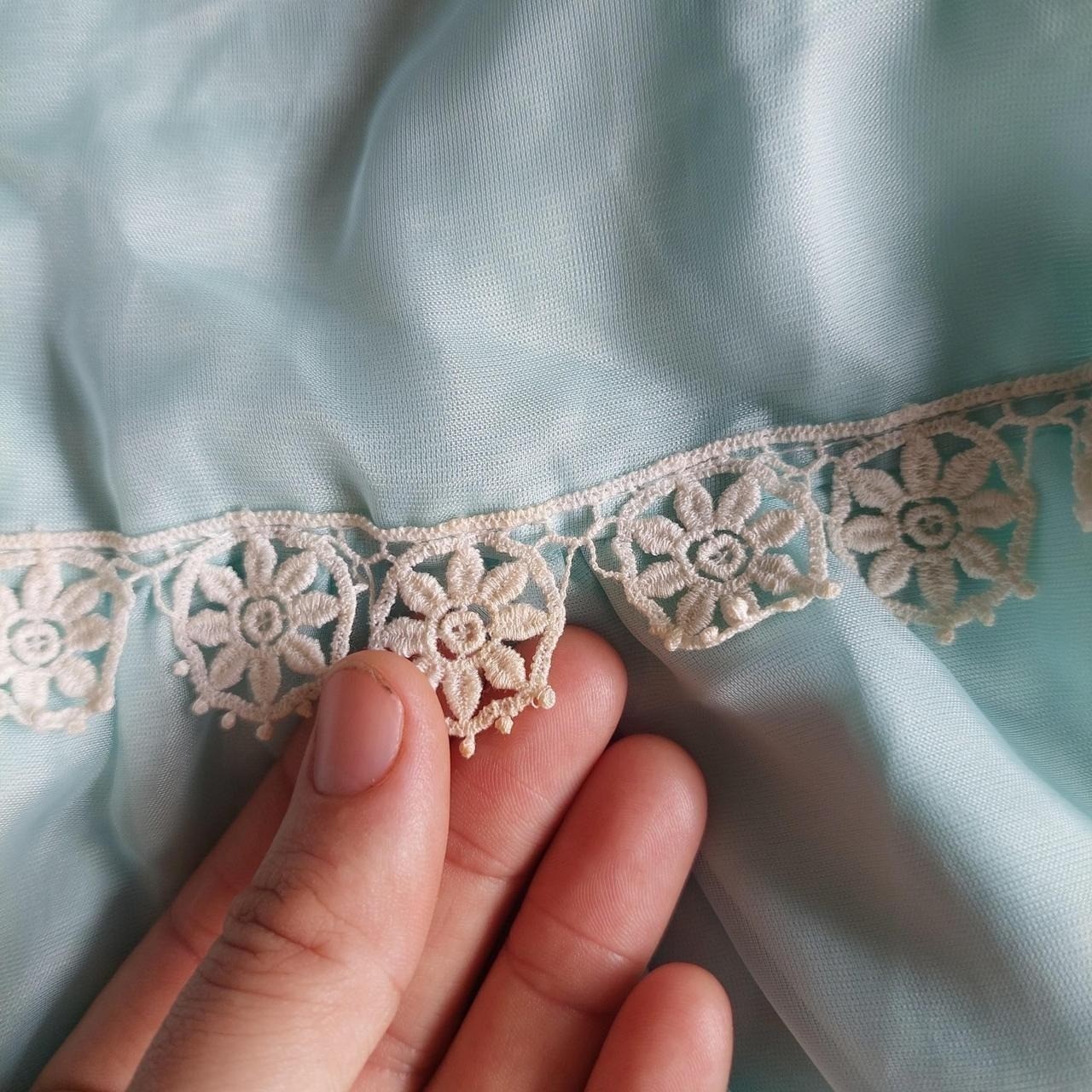 Vintage baby blue dress/ tunic with sheer sleeves, lace trim, and pearl buttons.