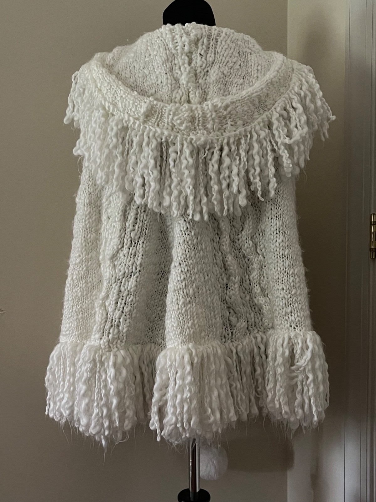 Adorable vintage white knit poncho with hood, fringe and pom poms