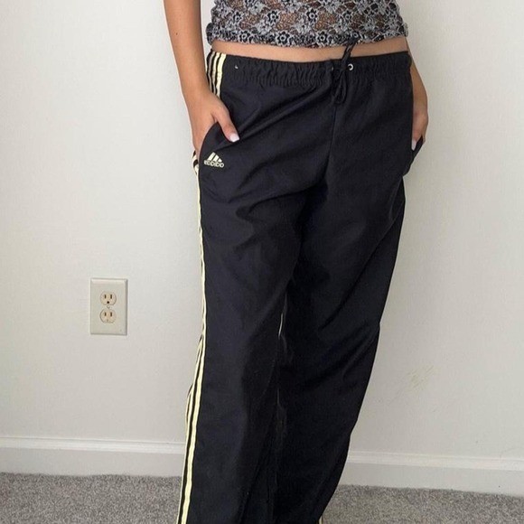 vintage adidas sporty black low waist track pants with yellow stripes