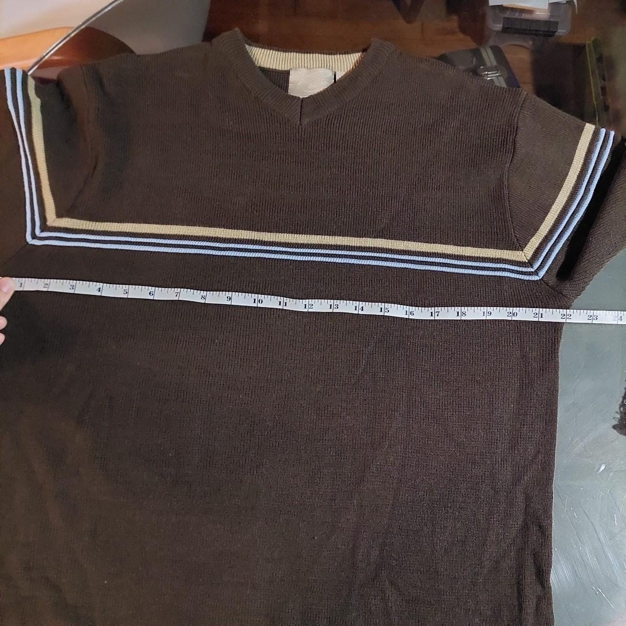 Vintage brown, blue, and tan sweater with striped detail.