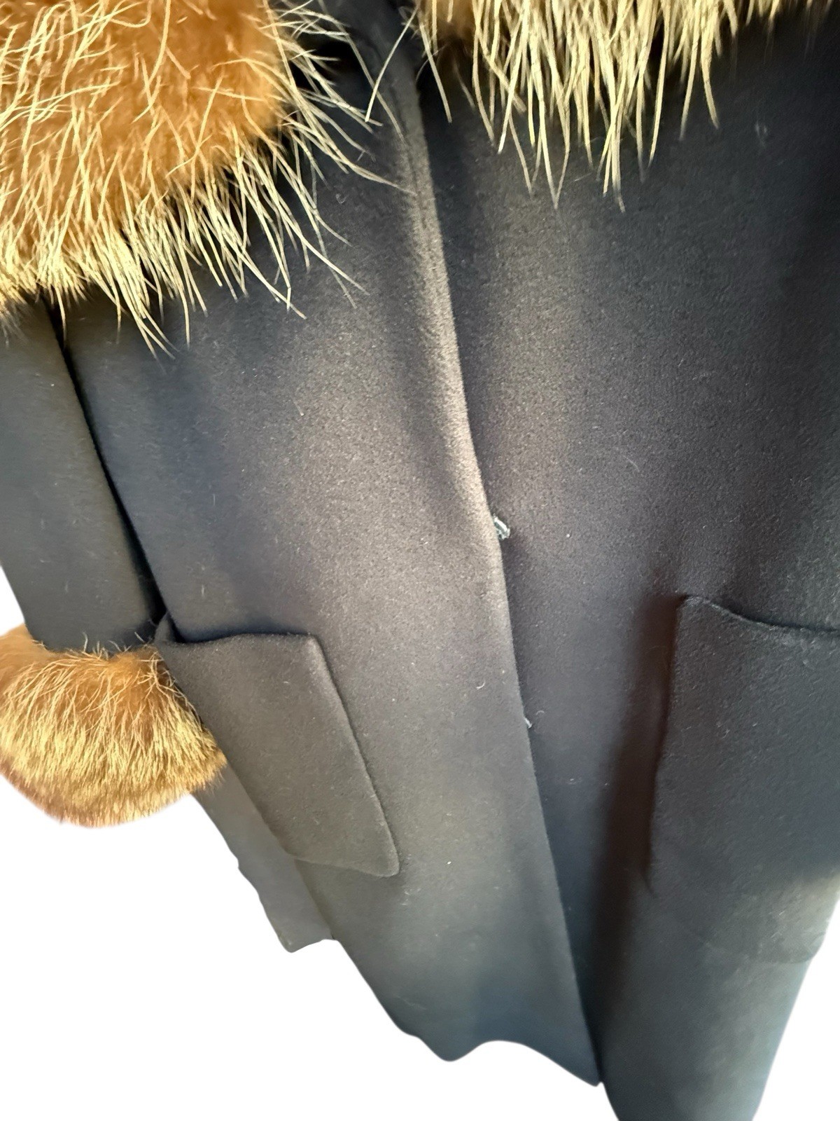 Absolutely Gorgeous Vintage black wool coat with Raccoon fur collar and wrists