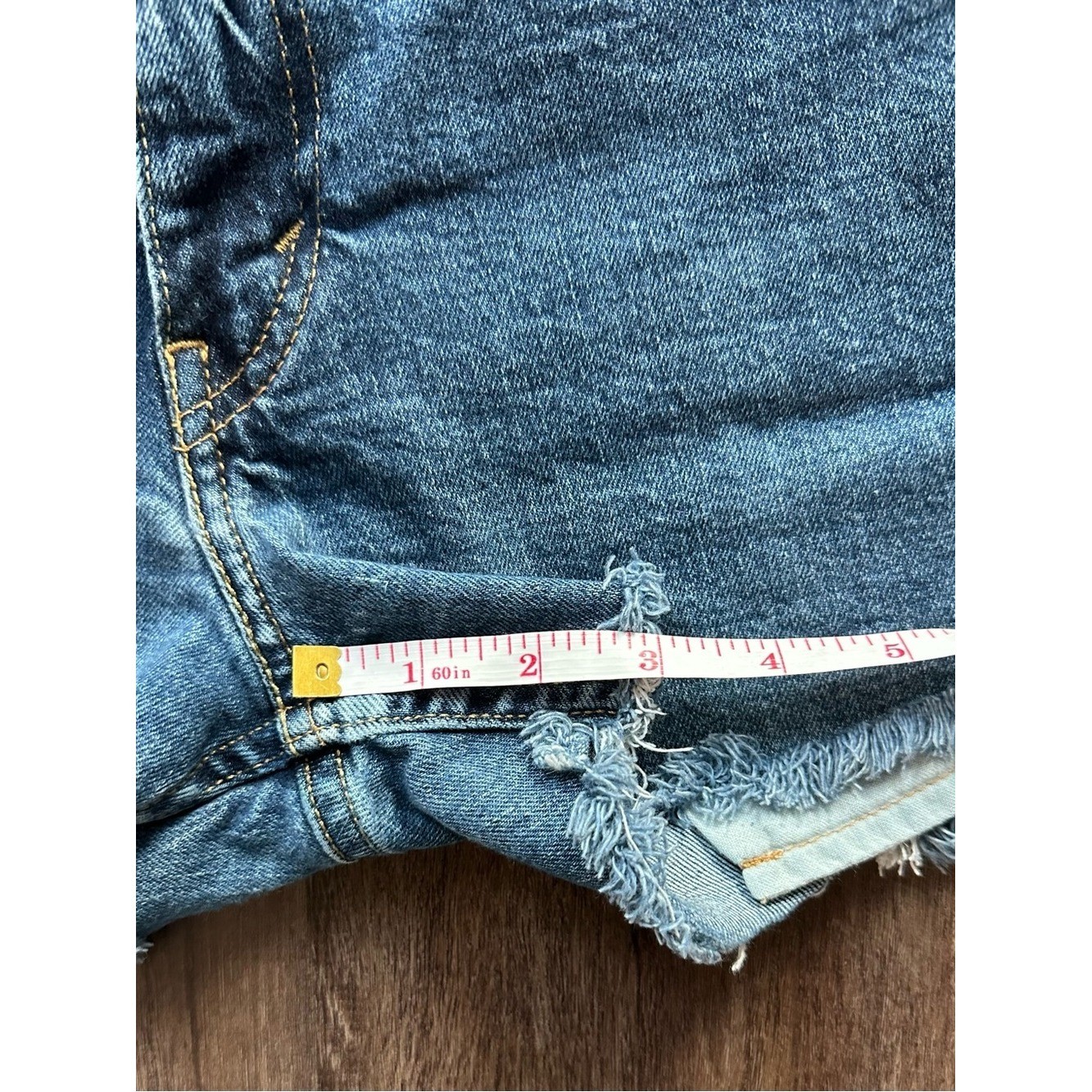 Upcycled Levi’s 511 Cut Off Shorts with Embroidered Pockets. Size 28; Runs Small