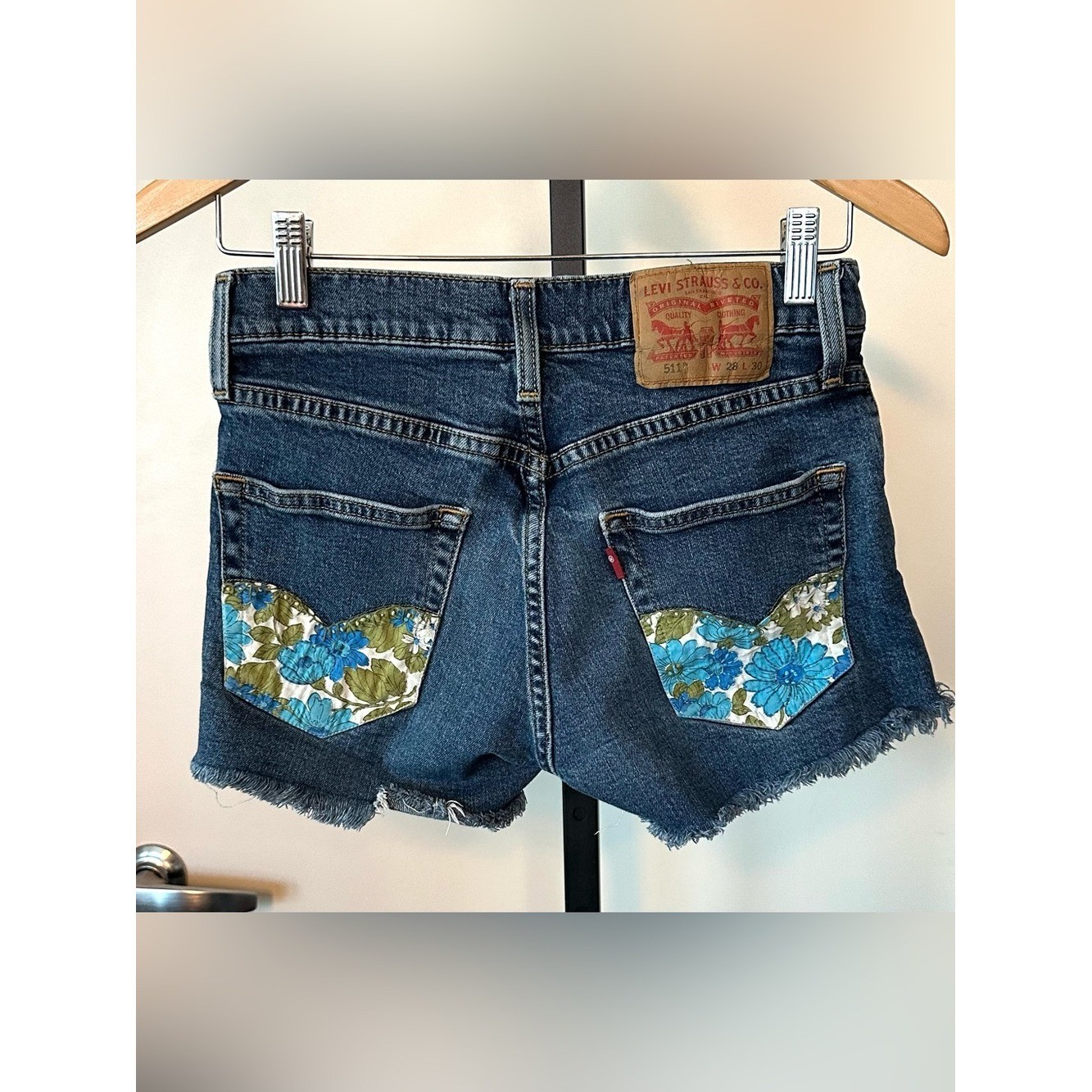 Upcycled Levi’s 511 Cut Off Shorts with Embroidered Pockets. Size 28; Runs Small