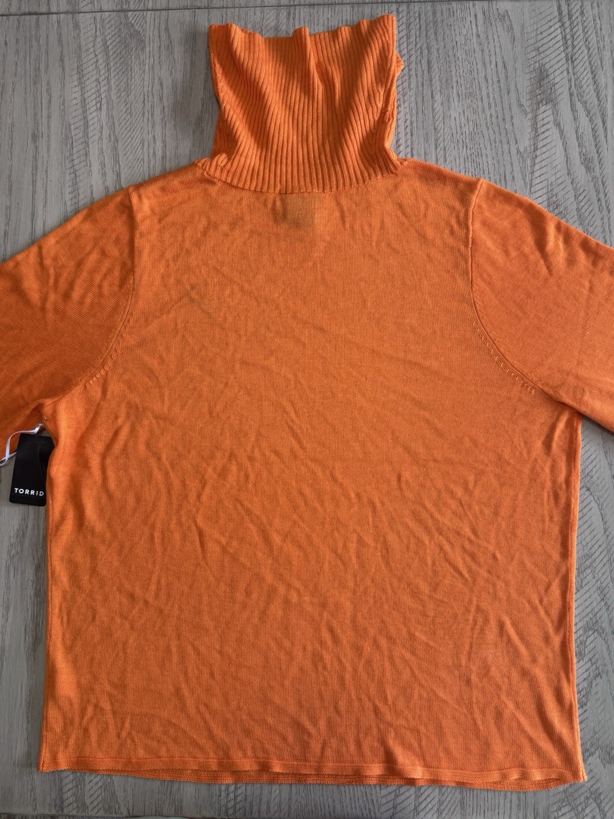 Scooby Doo Velma Turtleneck Pullover Sweater. Acrylic knit fabric. 100% acrylic.