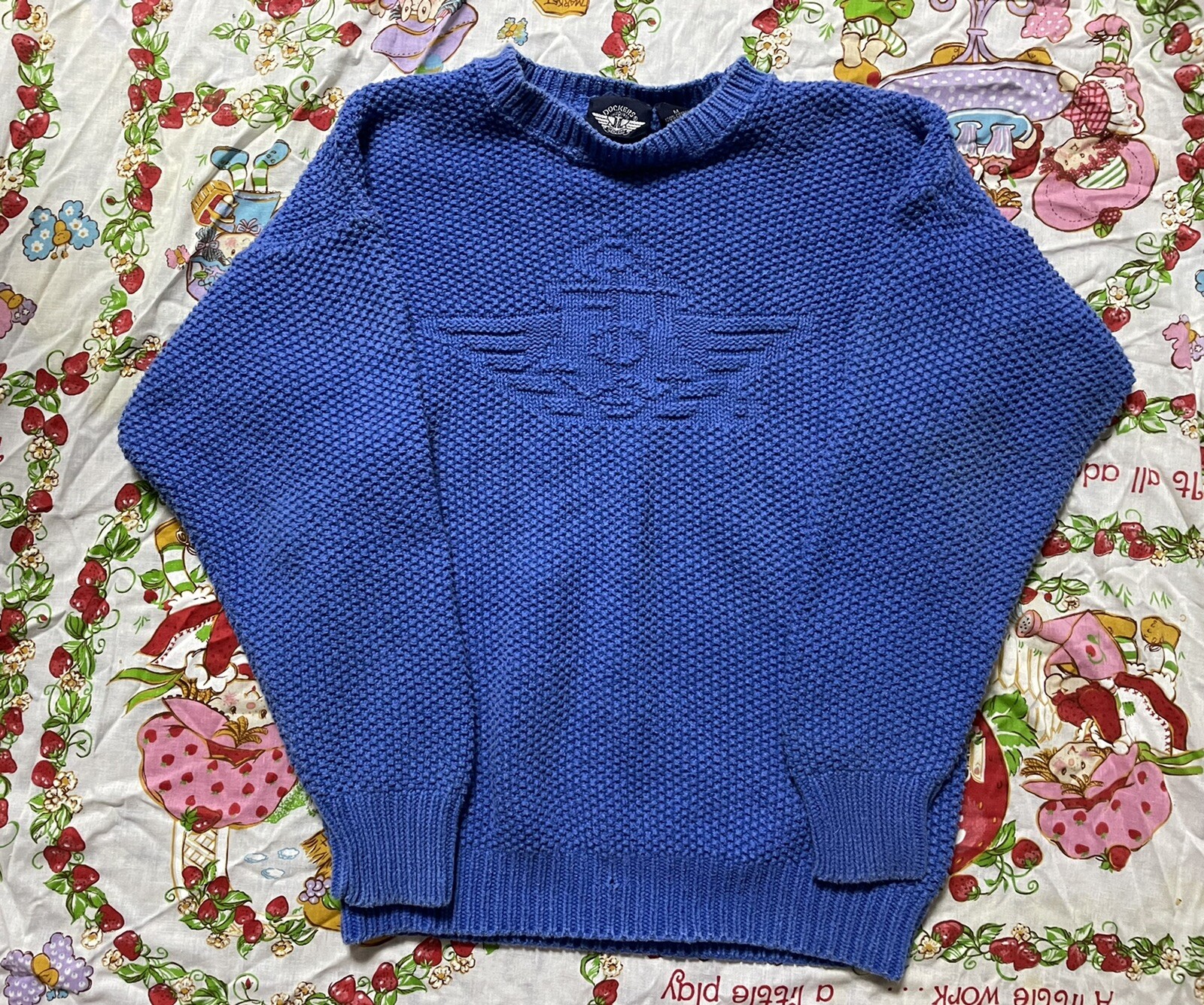 vintage 1980s dockers ladies blue knitted logo symbol sweater. Size medium