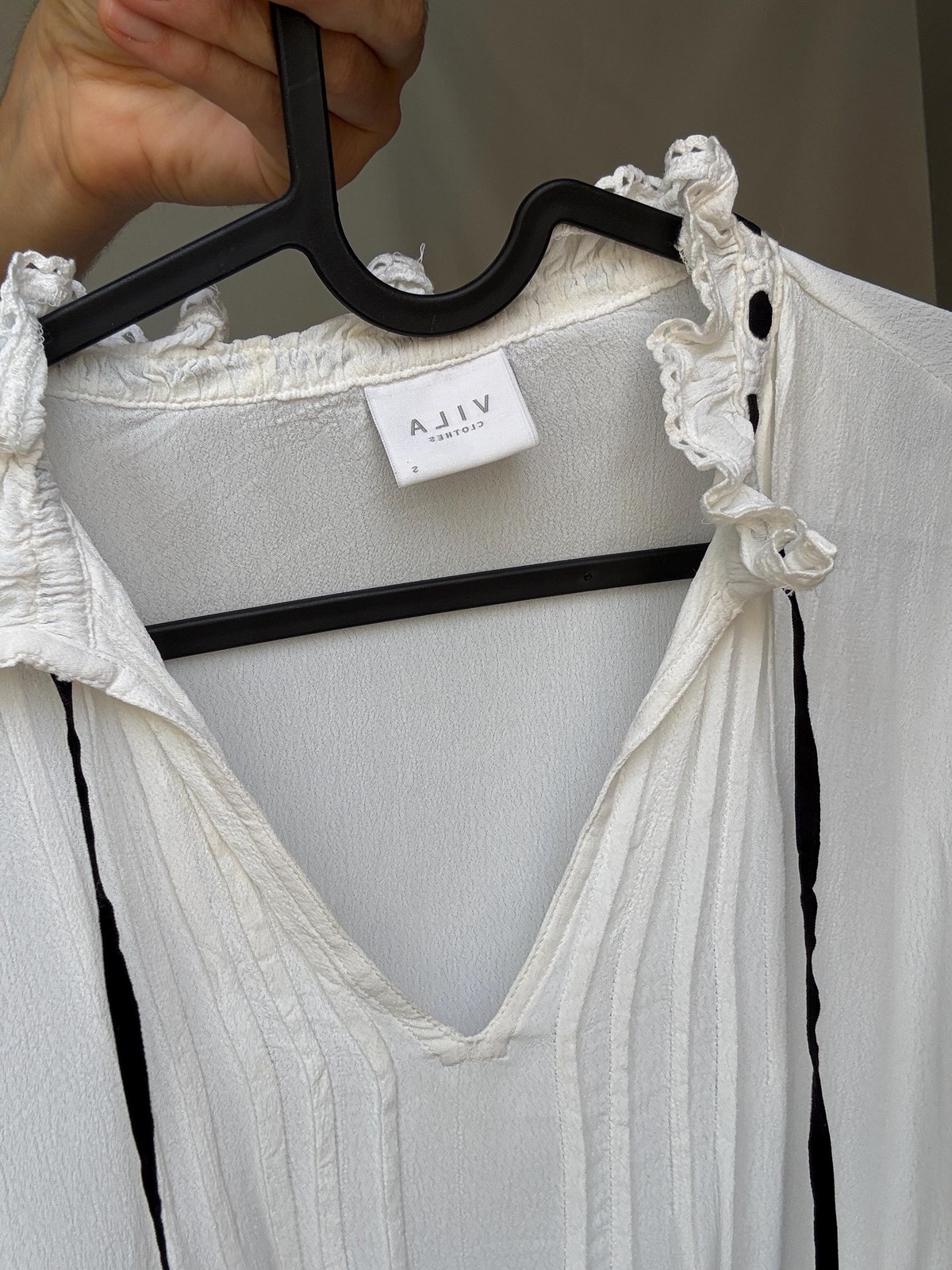 Romantic Bohemian White Blouse with Black Tie Detailing, Flowing Sleeves, and Ru