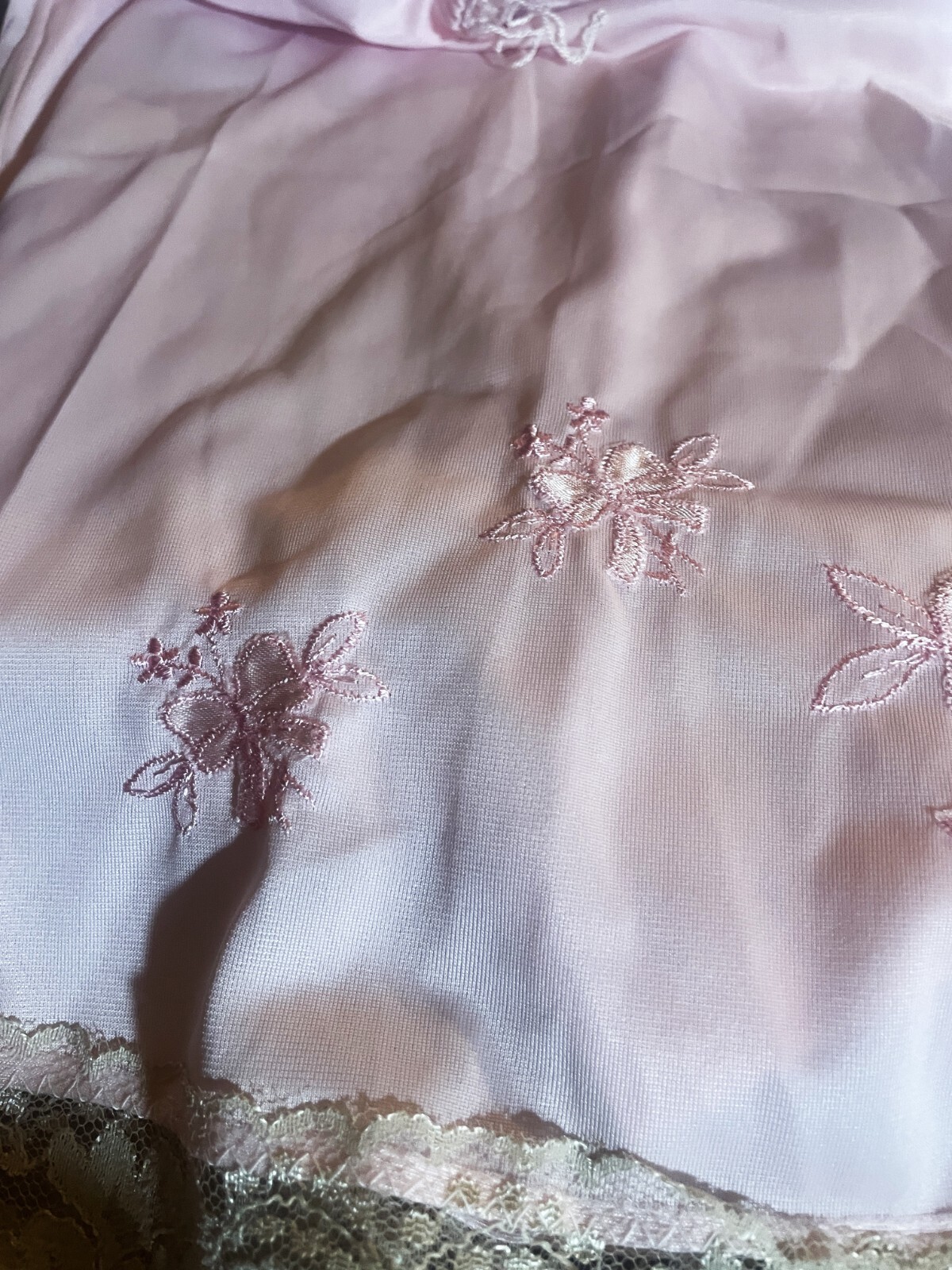1970’s size small Pink 1/2 slip 20 inches long pink on pink embroidered tan lace