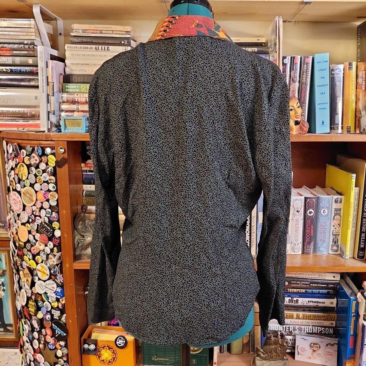 Vintage green and black leap pattern with a orange patterned collar button top.