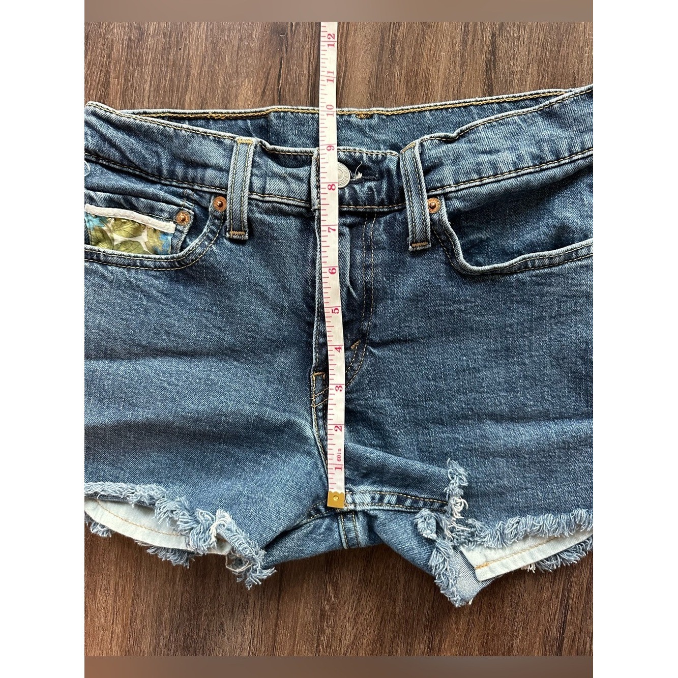 Upcycled Levi’s 511 Cut Off Shorts with Embroidered Pockets. Size 28; Runs Small