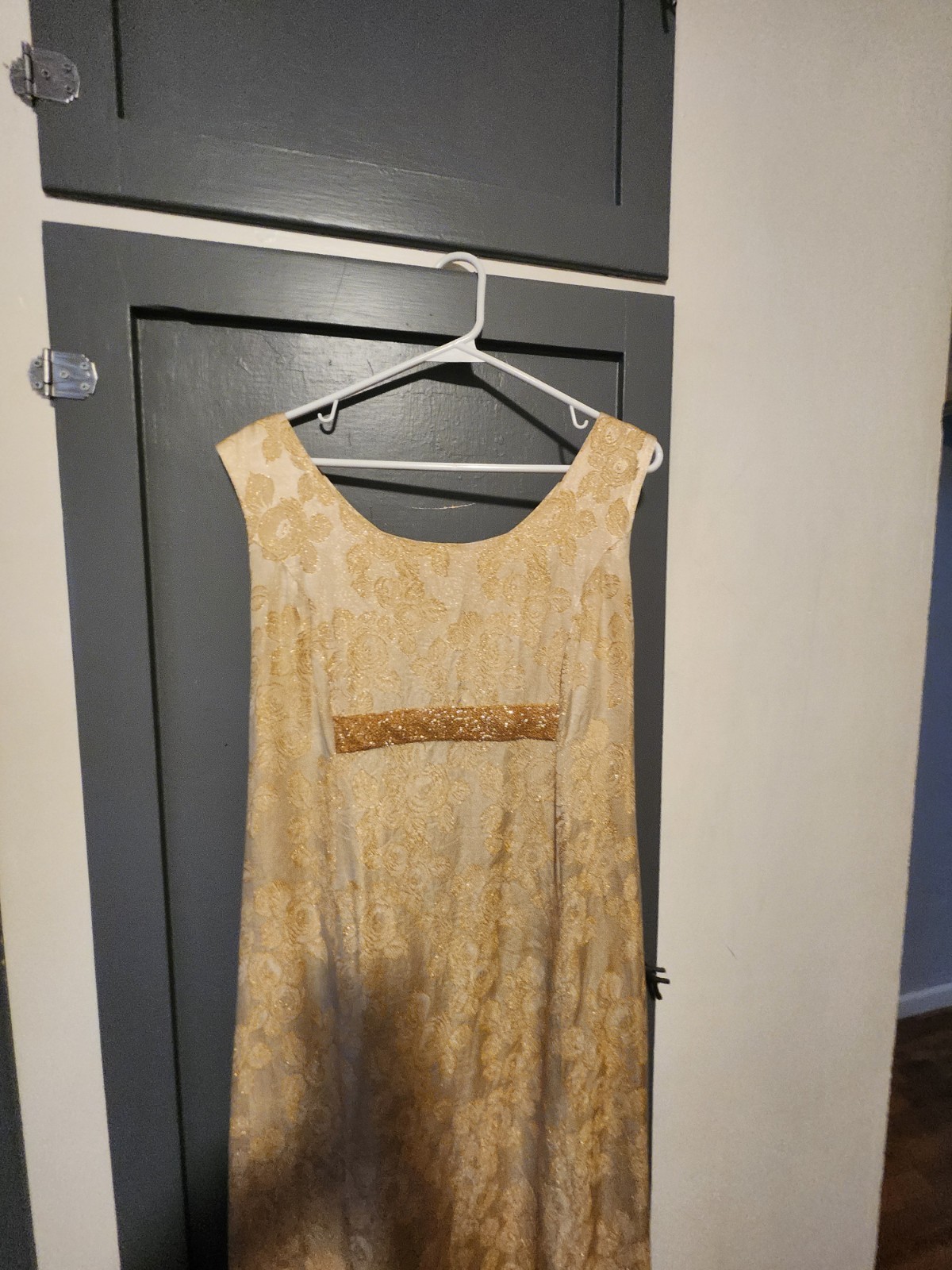 1960s gold floral brocade maxi dress featuring a scoop neckline Size S