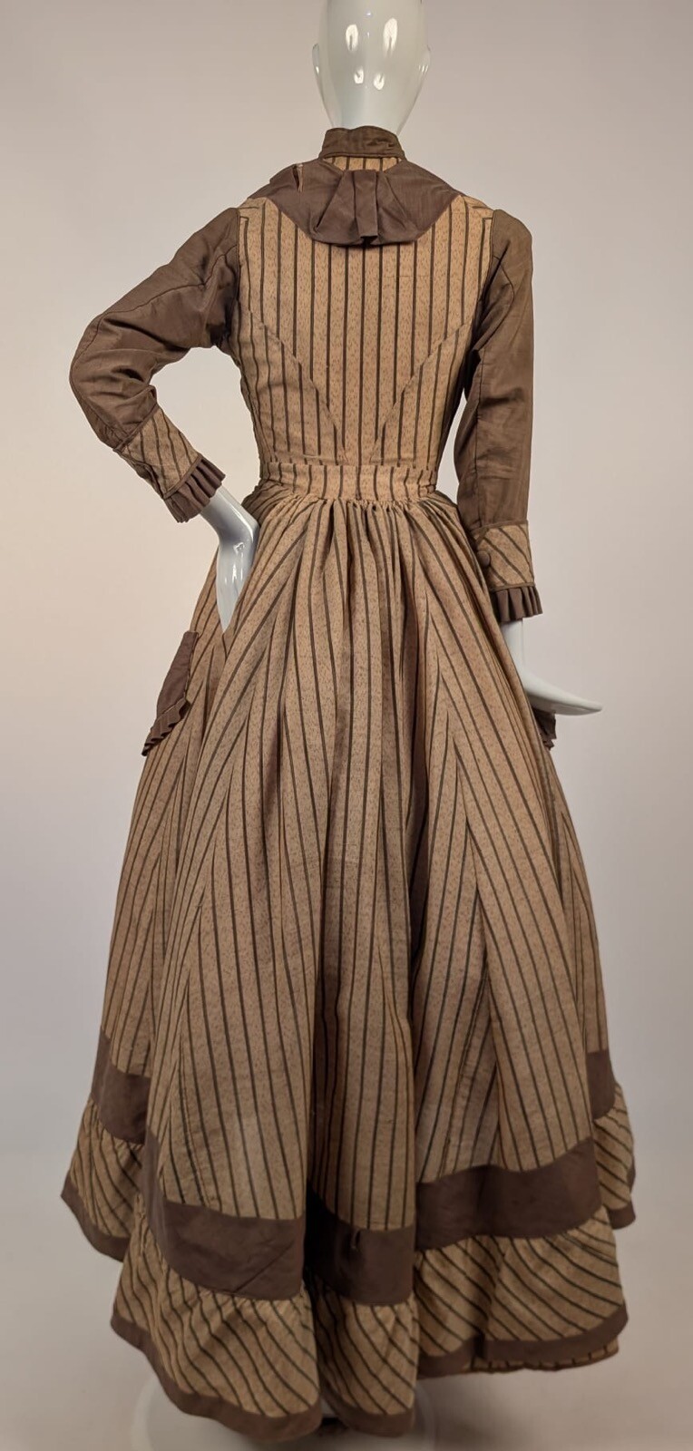 LATE 1860’S PINSTRIPED TAN BOMBAZINE DRESS W BOWS + SIDE POCKET DETAIL