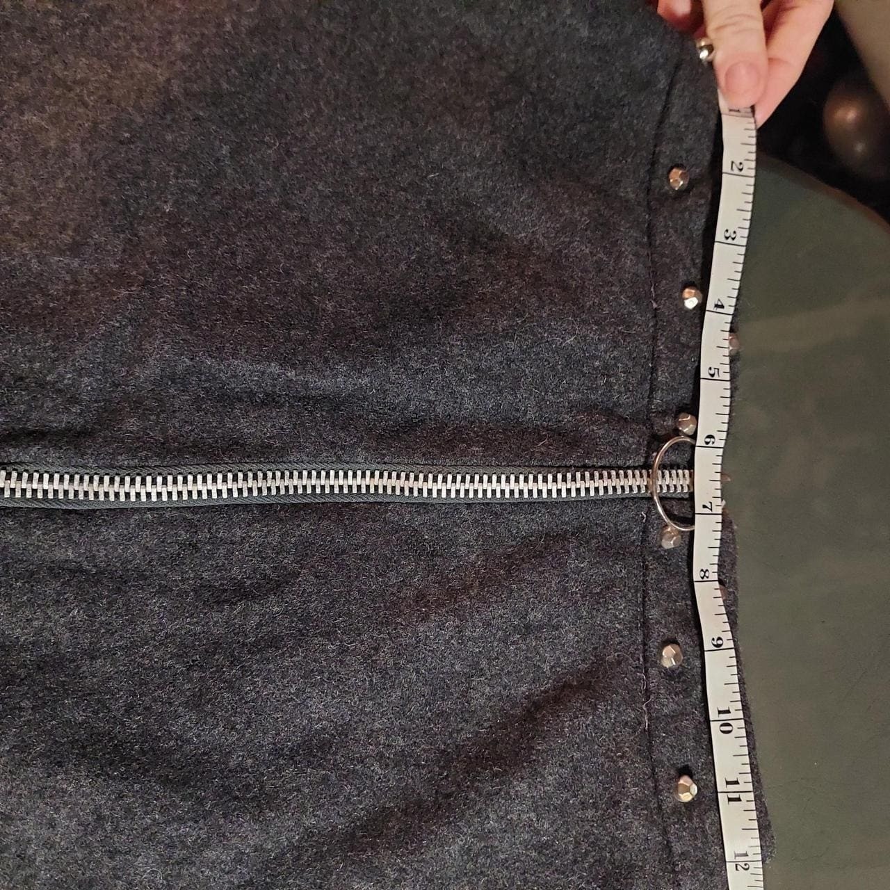 Vintage dark grey mini skirt with metal zipper and metal stud details.
