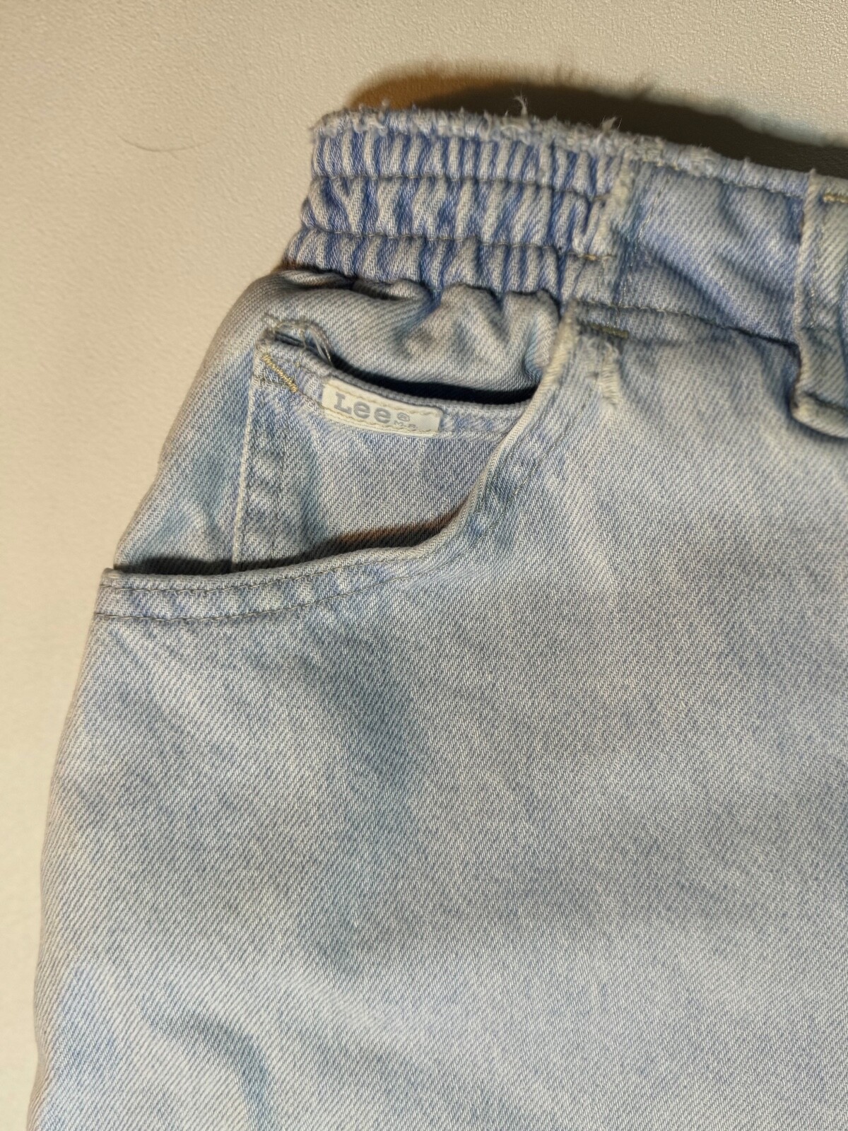 Vintage 1990’s Lee light wash denim jeans, elastic band on each side, 27″ Inseam