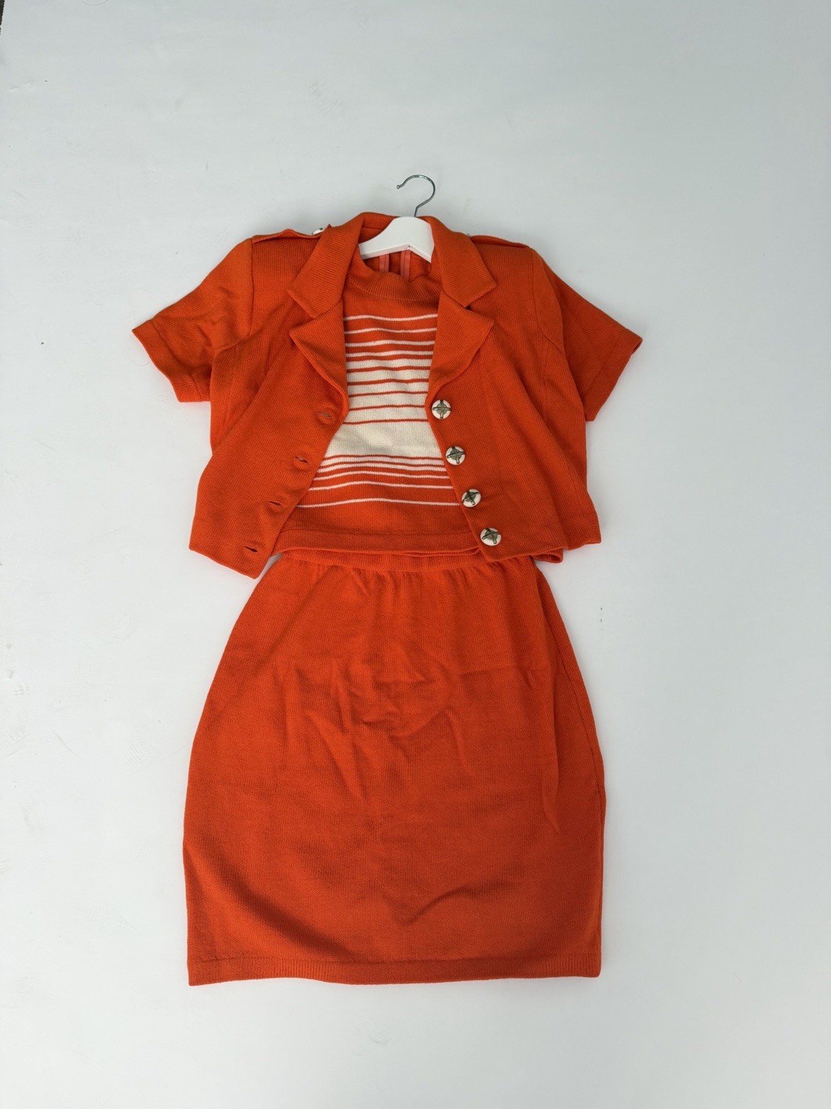 vintage women’s orange knit skirt suit set, 1960s or 1970s St John Style Fabric