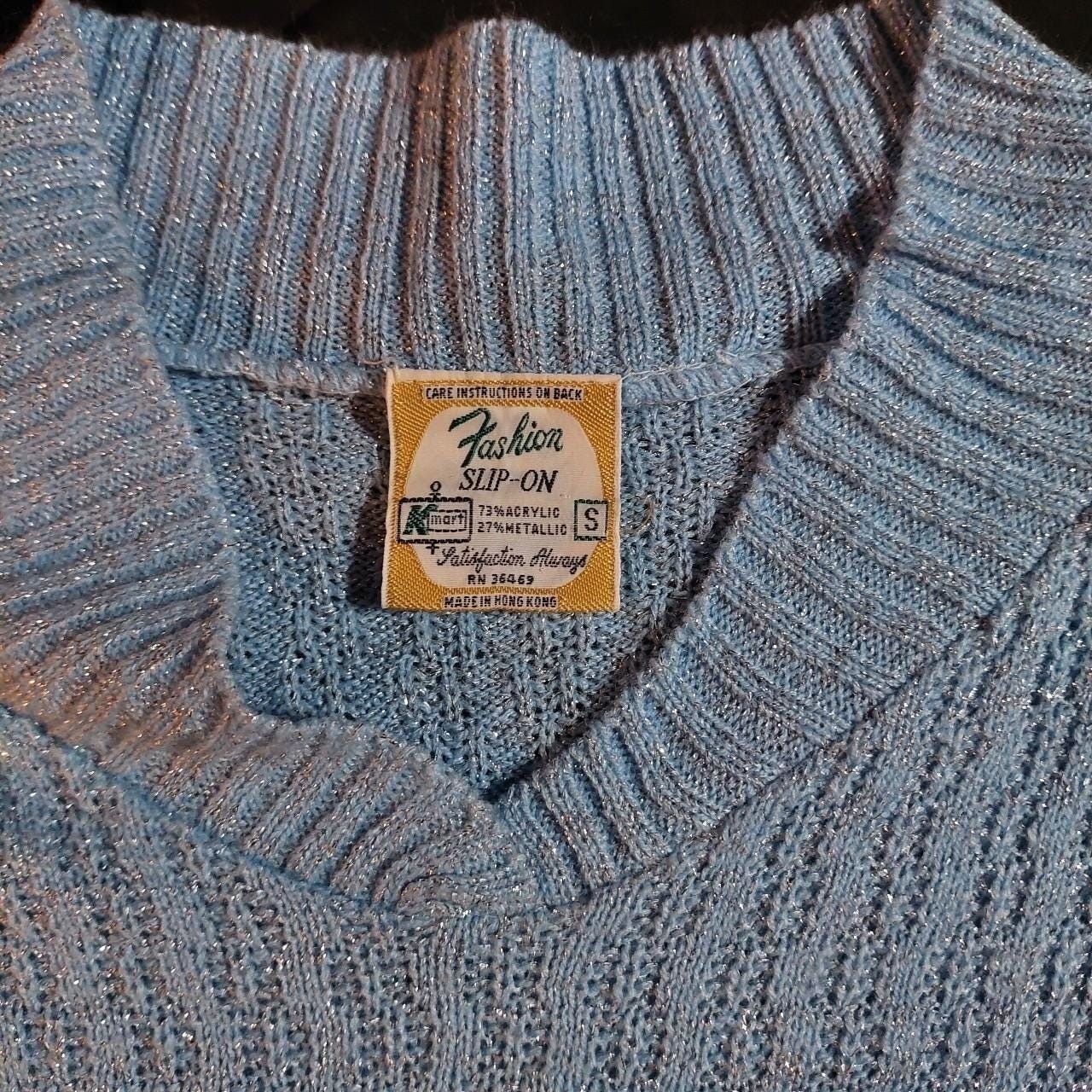 Vintage baby blue and silver metallic sweater.