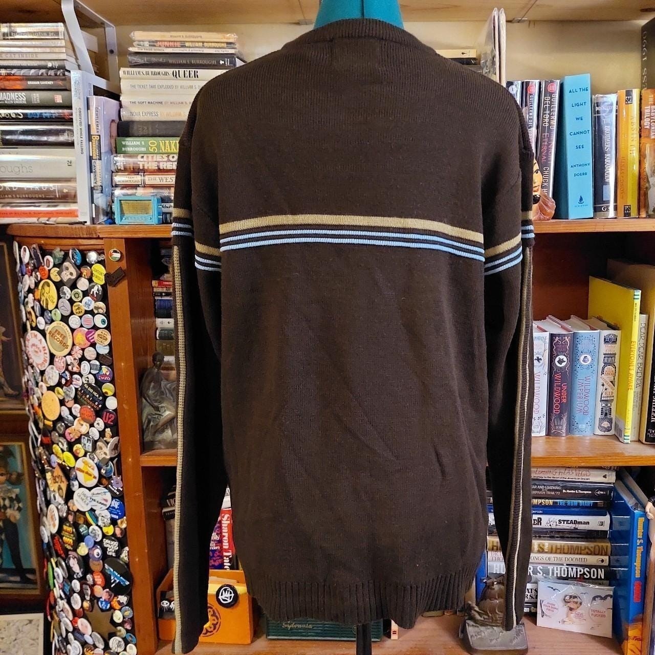 Vintage brown, blue, and tan sweater with striped detail.
