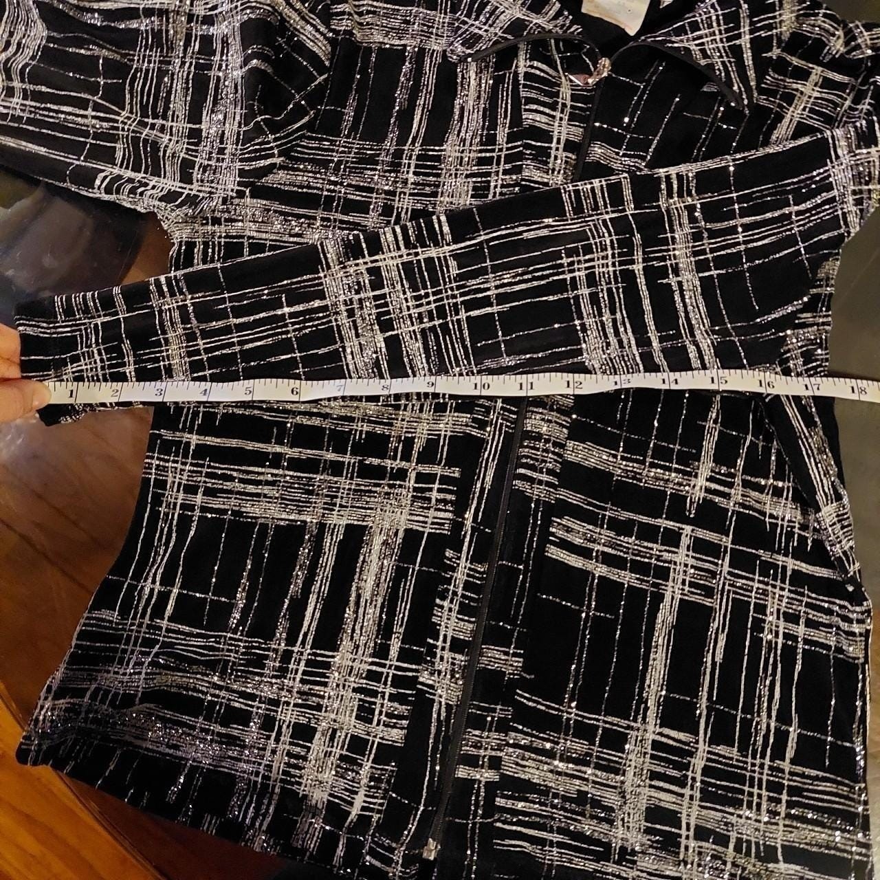 Vintage made in Canada black and silver zip up. It is slightly sheer and stretch