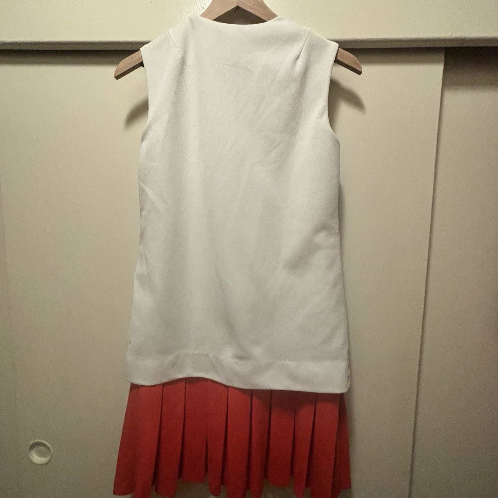 1960’s Mod style Eve Le Coq Mod white vest Attached Orange Pleated Skirt