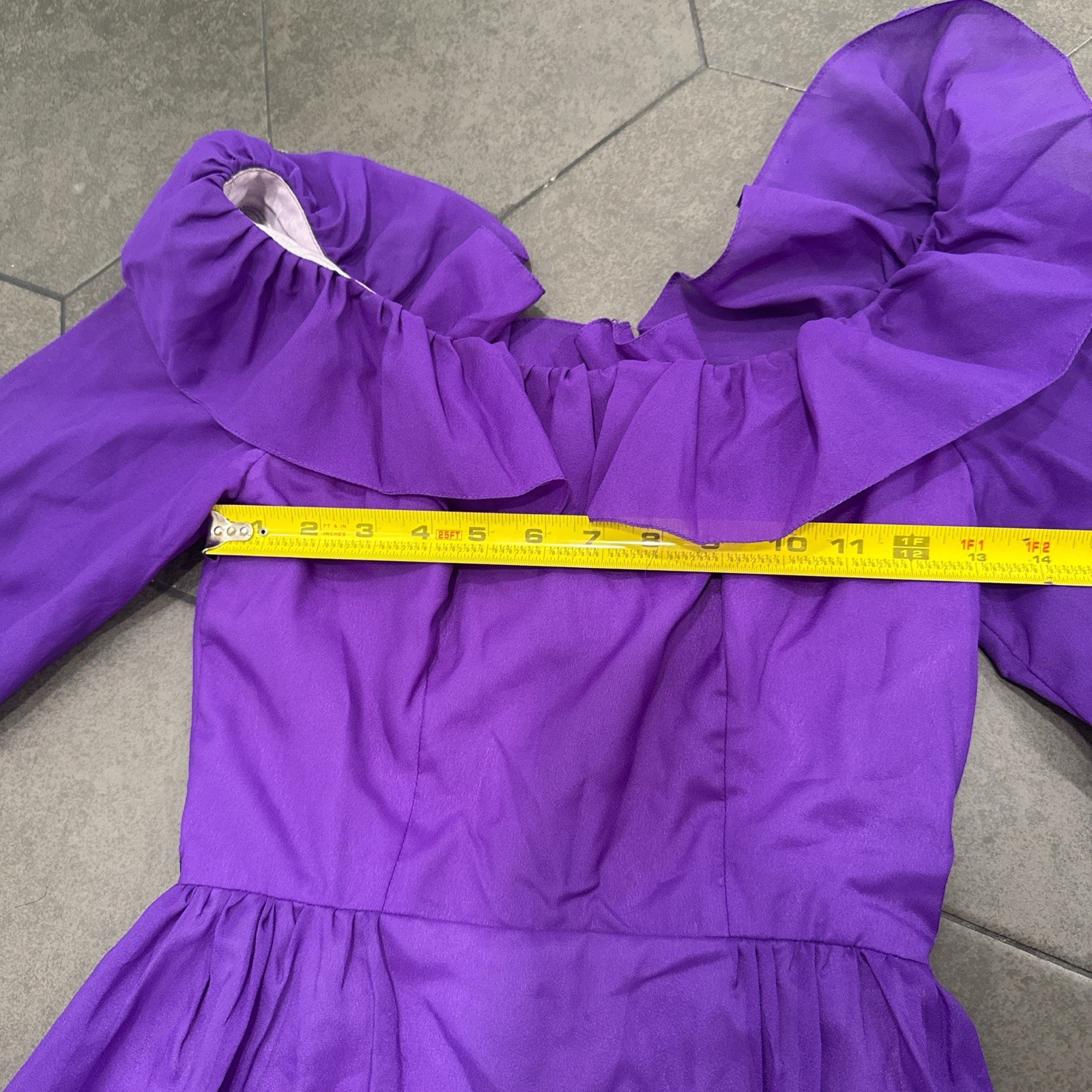 An vintage Priscilla Of Boston Chic long sleeve dress with ruffles.