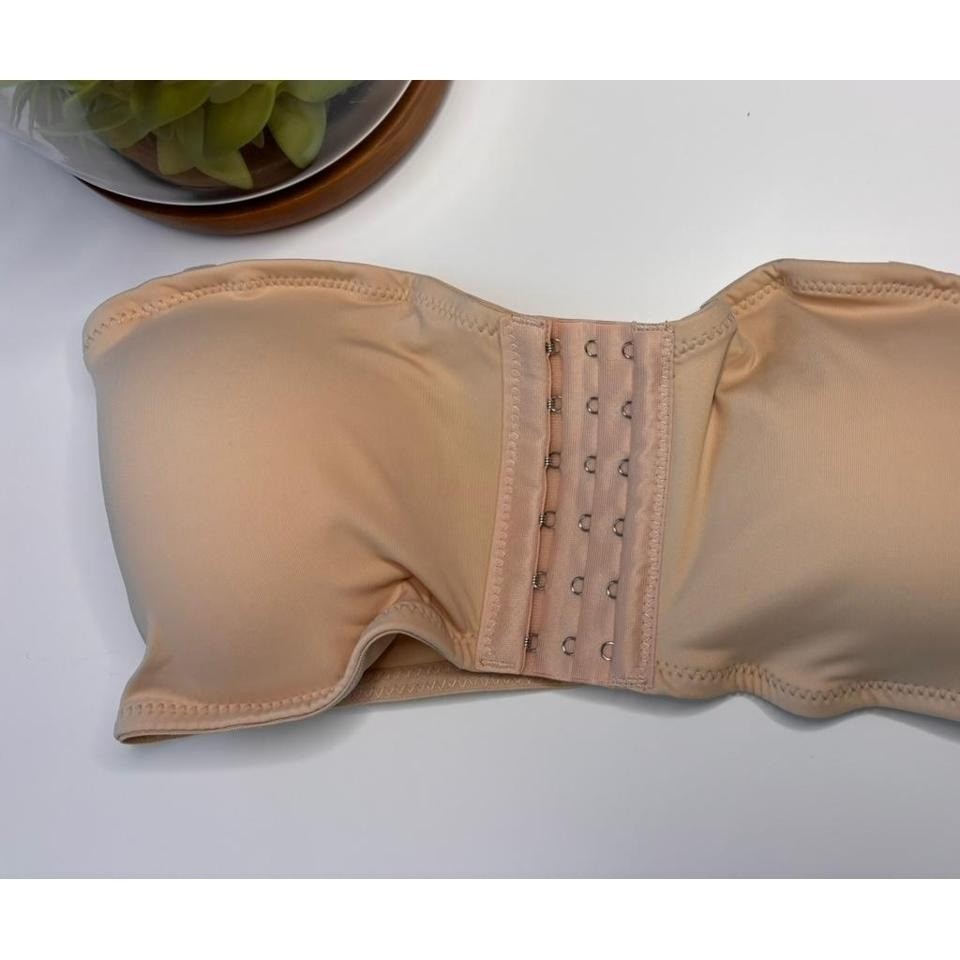 Beige strapless corset top bra with adjustable straps and hooks. Size: S