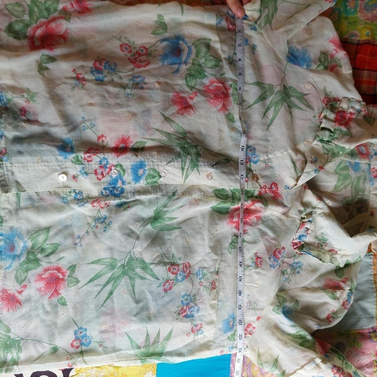 Vintage cream red, blue, and green floral short sleeve top with ruffle detail.
