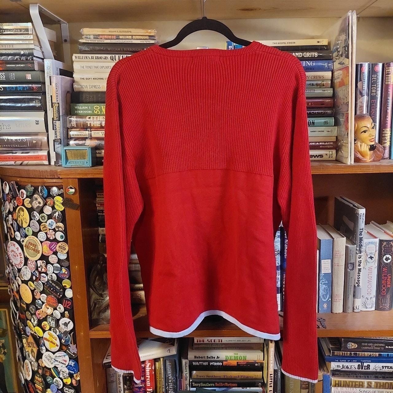 Vintage red sweater with a light blue detailing on the hemline and sleeves.