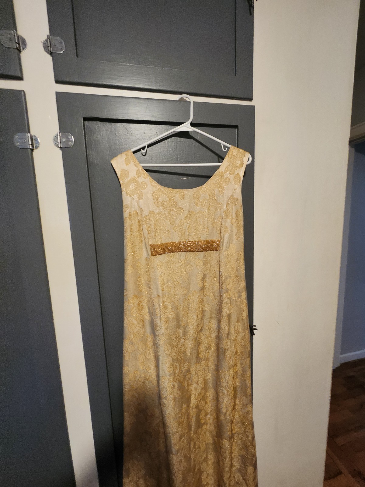 1960s gold floral brocade maxi dress featuring a scoop neckline Size S