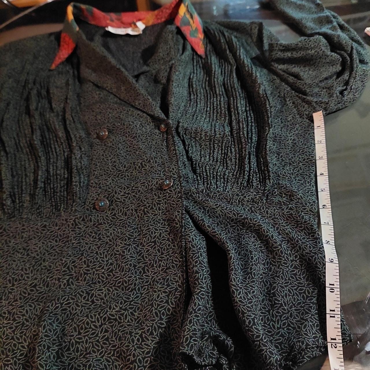 Vintage green and black leap pattern with a orange patterned collar button top.