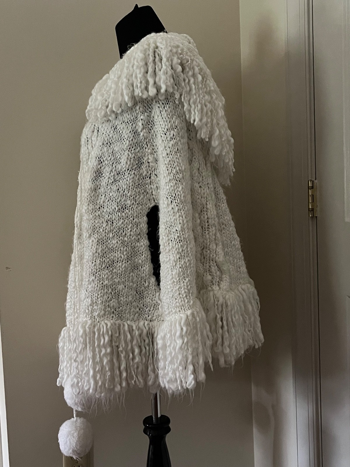 Adorable vintage white knit poncho with hood, fringe and pom poms