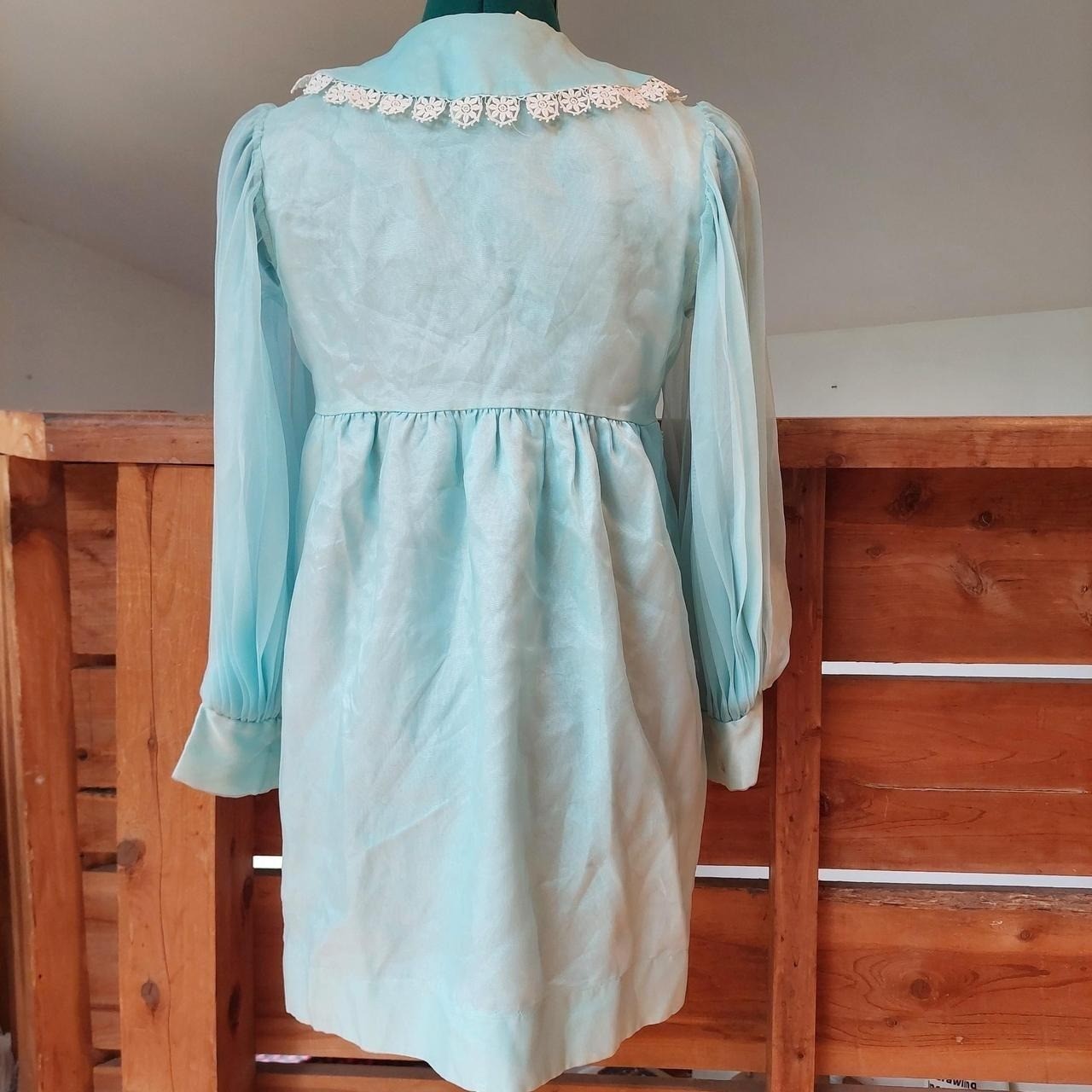 Vintage baby blue dress/ tunic with sheer sleeves, lace trim, and pearl buttons.
