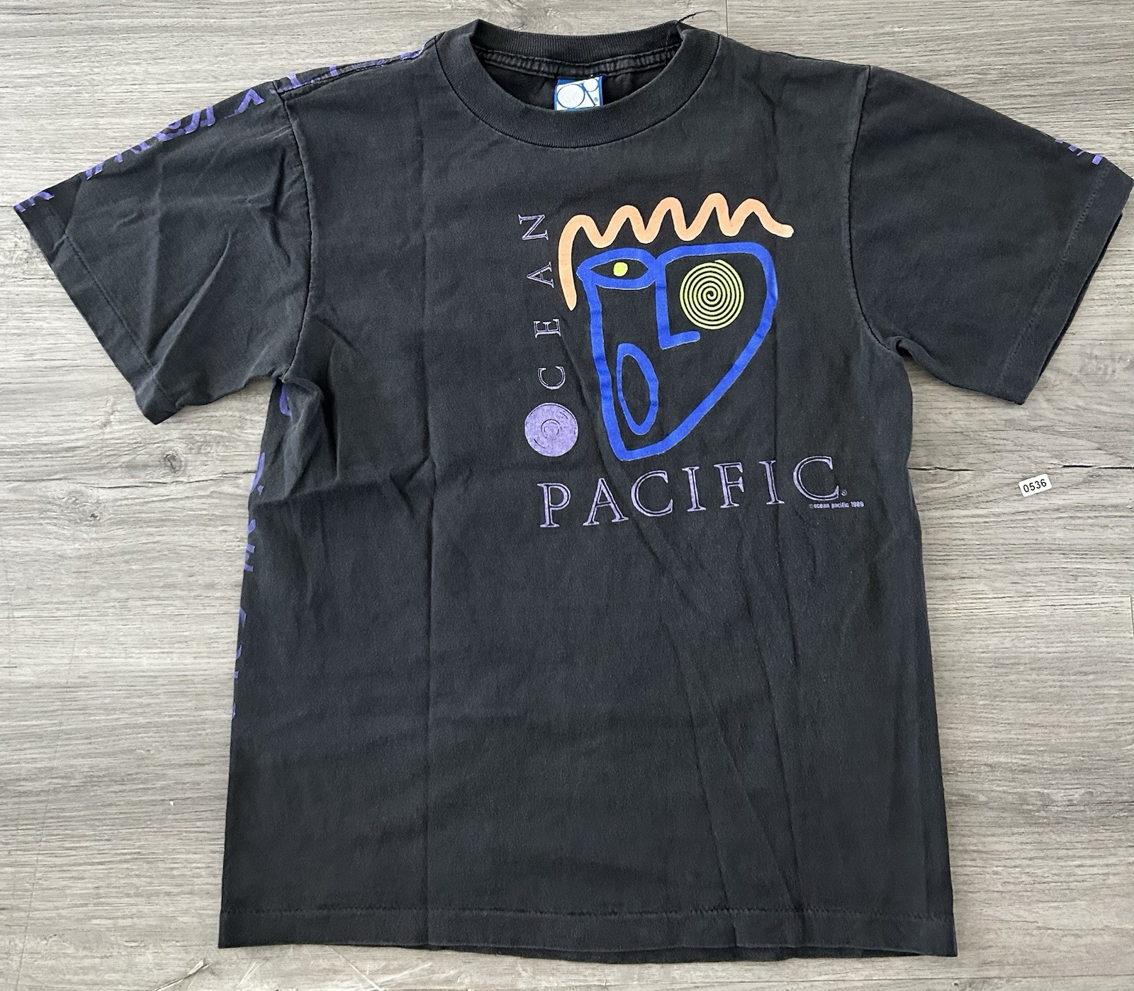 Vintage 90s Ocean Pacific AOP black graphic tee with purple accents USA Made