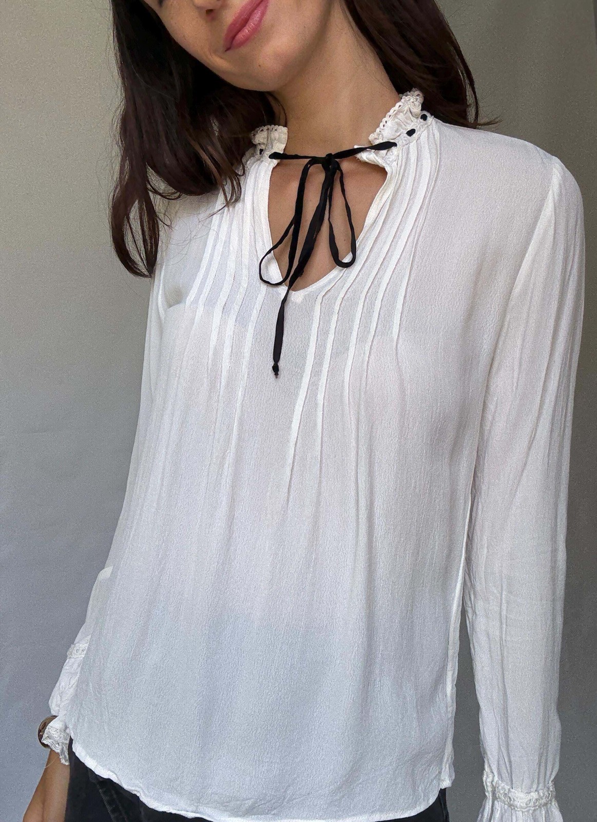 Romantic Bohemian White Blouse with Black Tie Detailing, Flowing Sleeves, and Ru