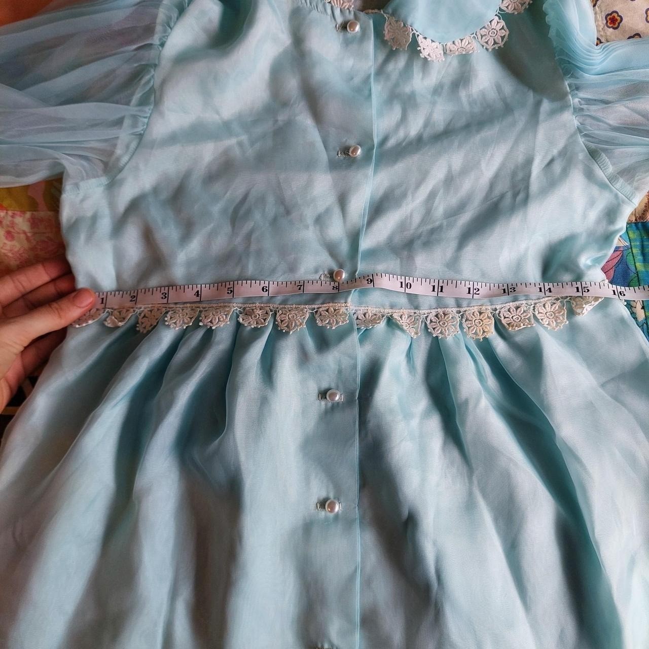 Vintage baby blue dress/ tunic with sheer sleeves, lace trim, and pearl buttons.