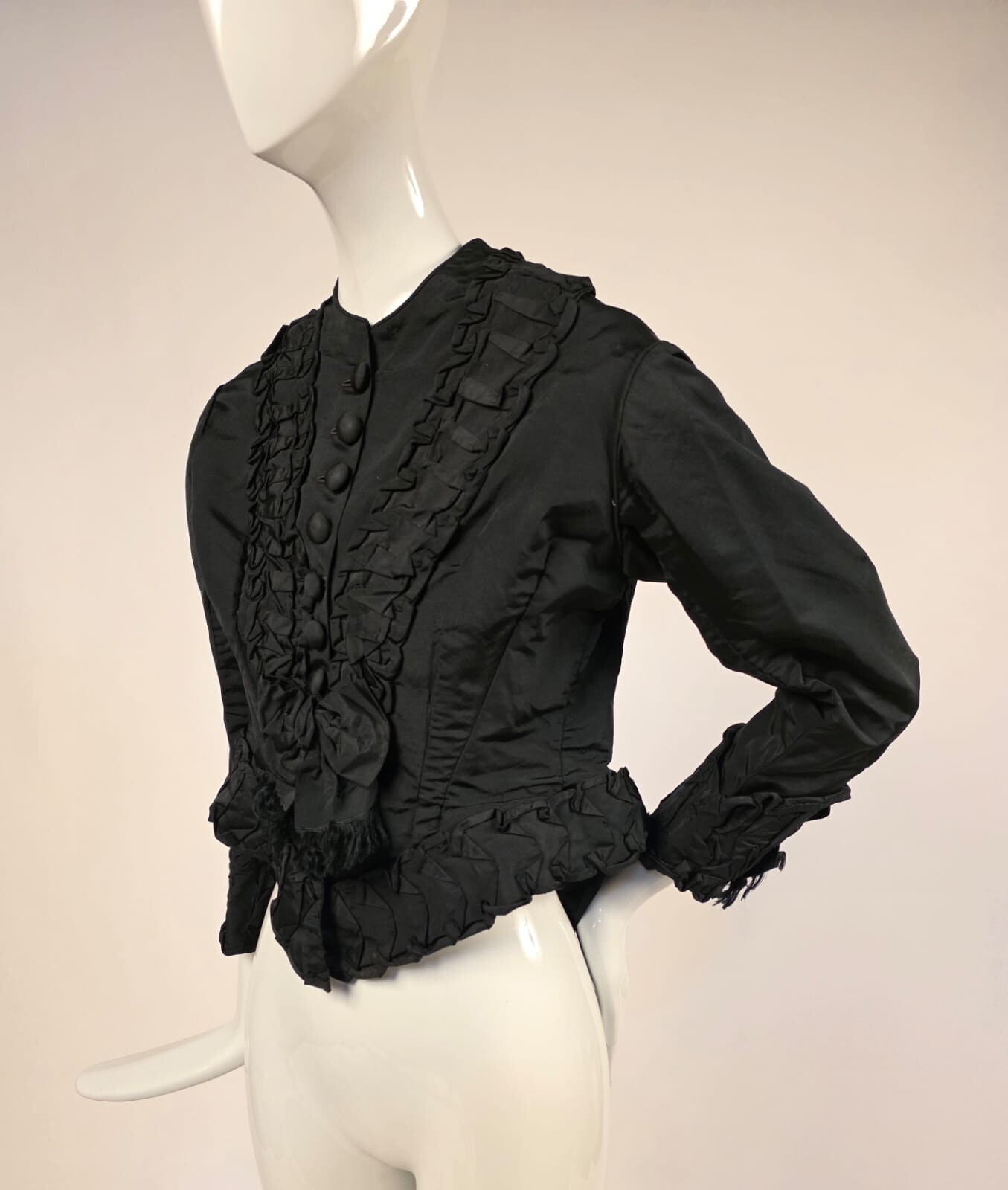 LATE 1860’S BLACK SILK JACKET W RUFFLES + BOW TRIM