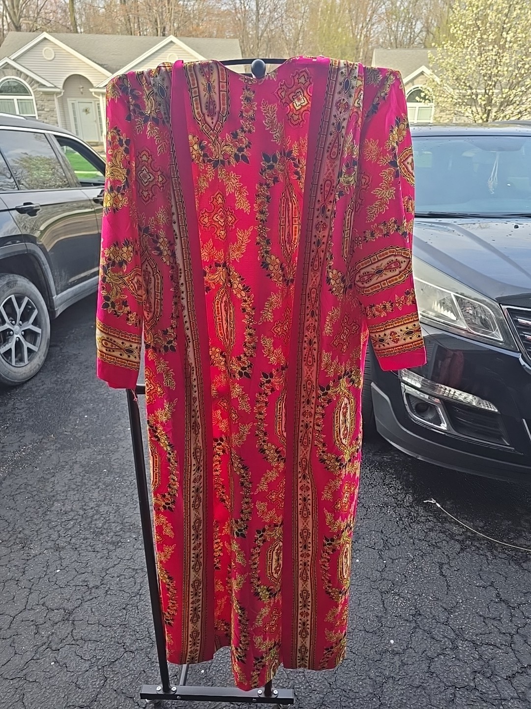 This vibrant piece is from the vintage brand Timely Fashions of Miami