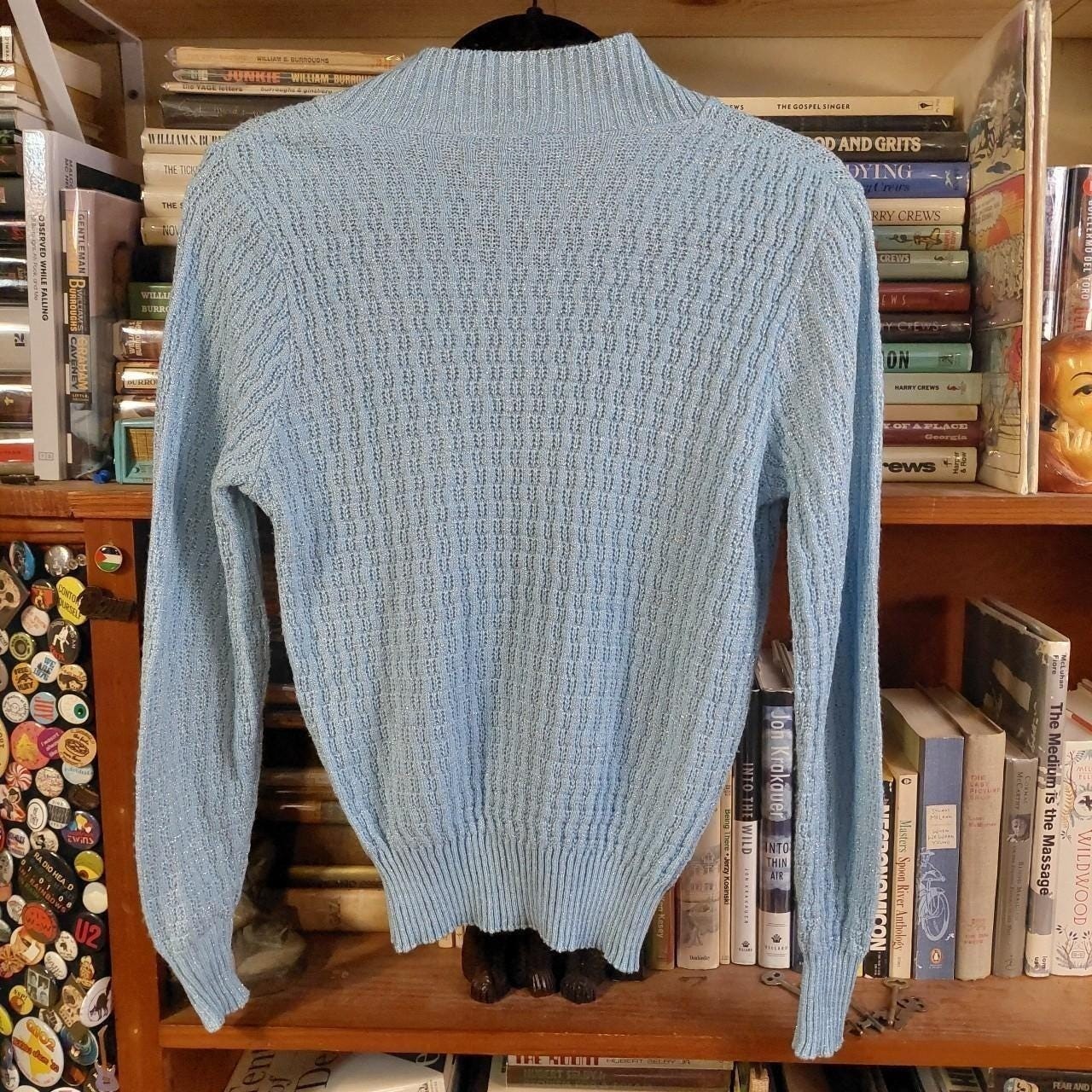 Vintage baby blue and silver metallic sweater.