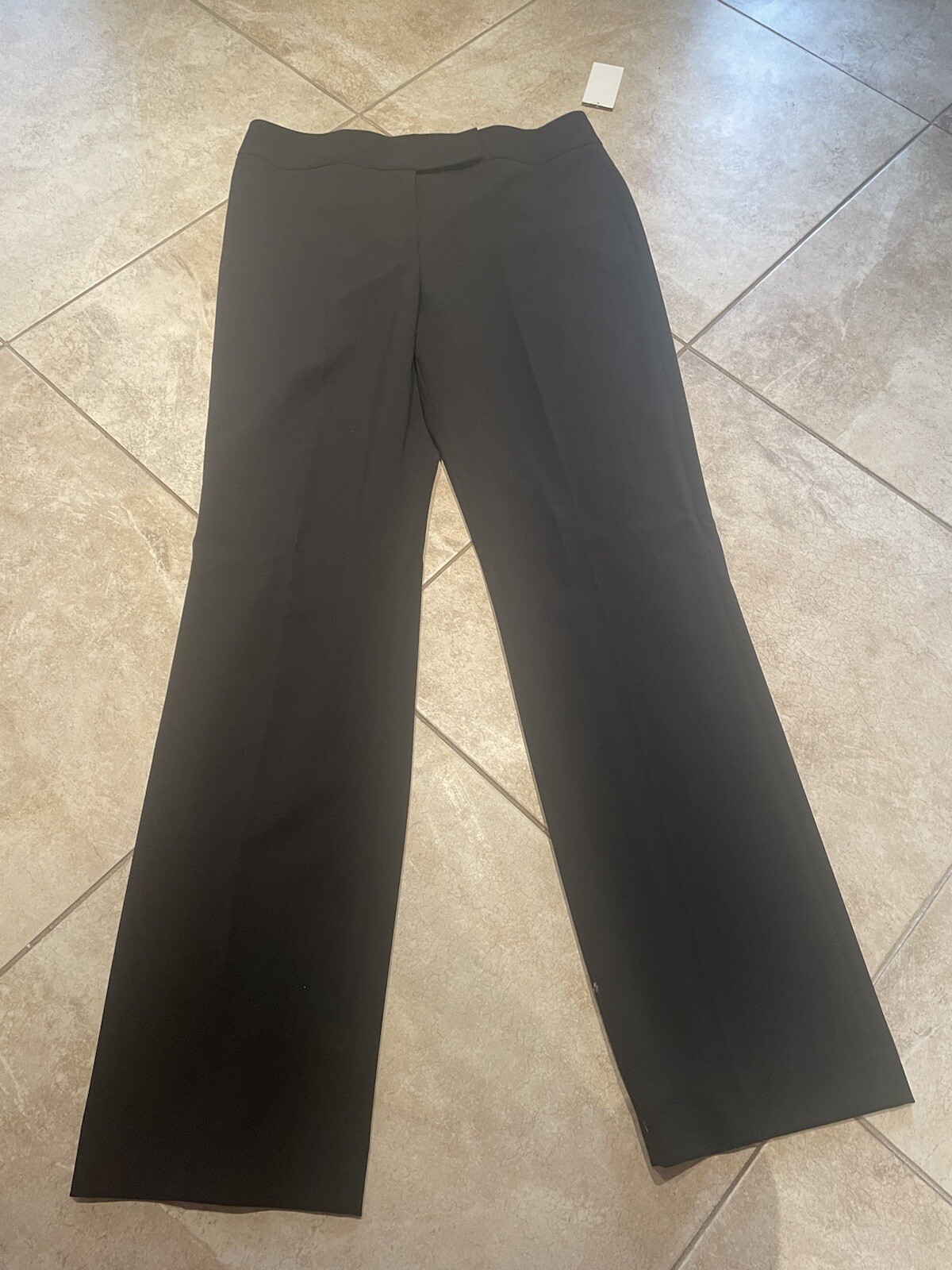 Tahari Arthur S. Levine 2 piece garment, blazer and pants. Size 10. Color black.