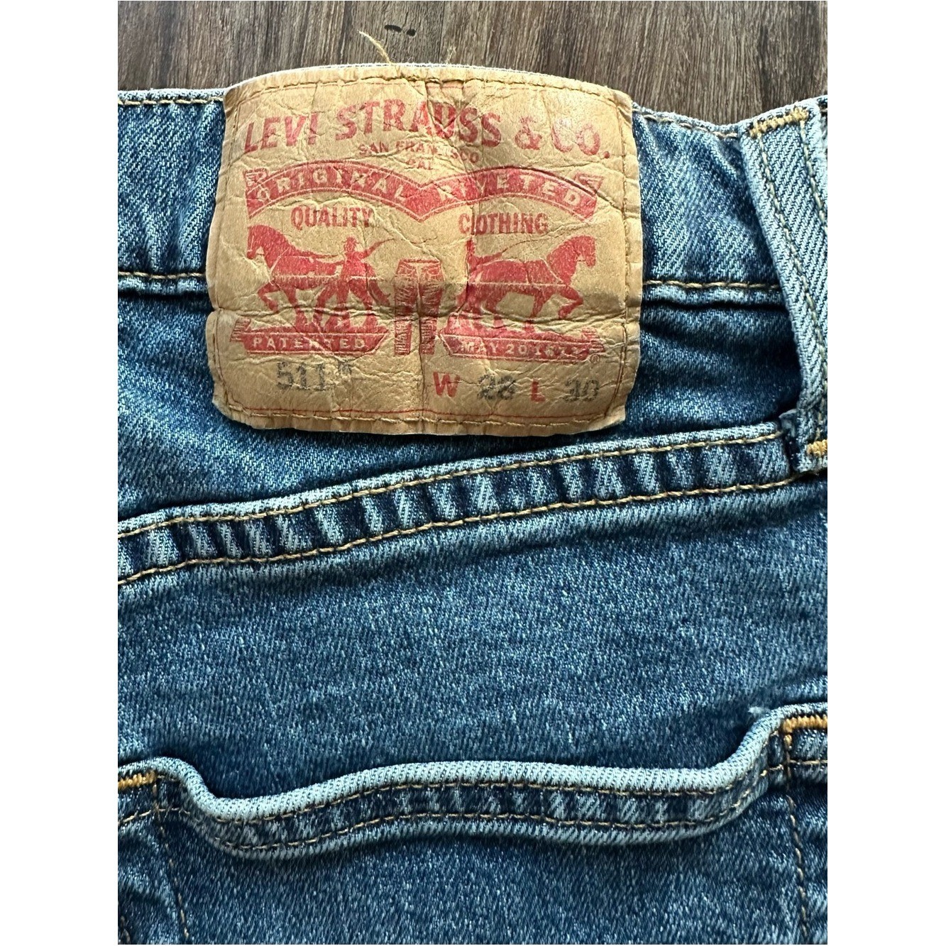 Upcycled Levi’s 511 Cut Off Shorts with Embroidered Pockets. Size 28; Runs Small
