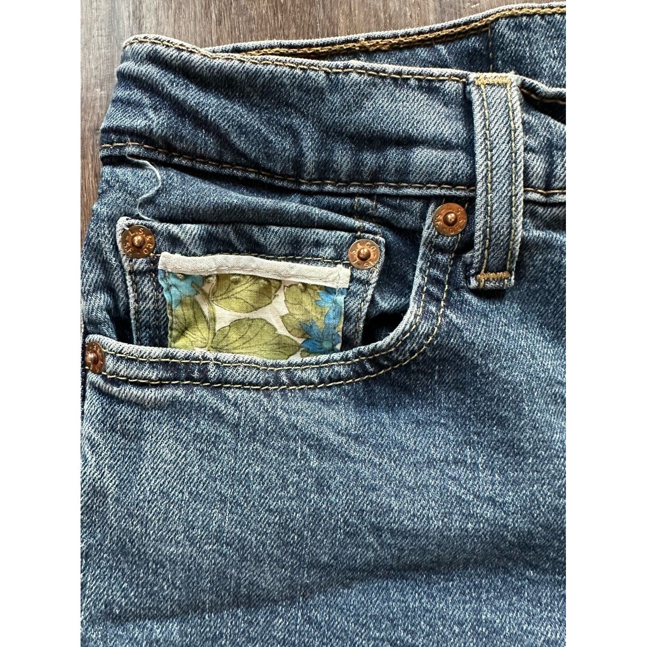 Upcycled Levi’s 511 Cut Off Shorts with Embroidered Pockets. Size 28; Runs Small
