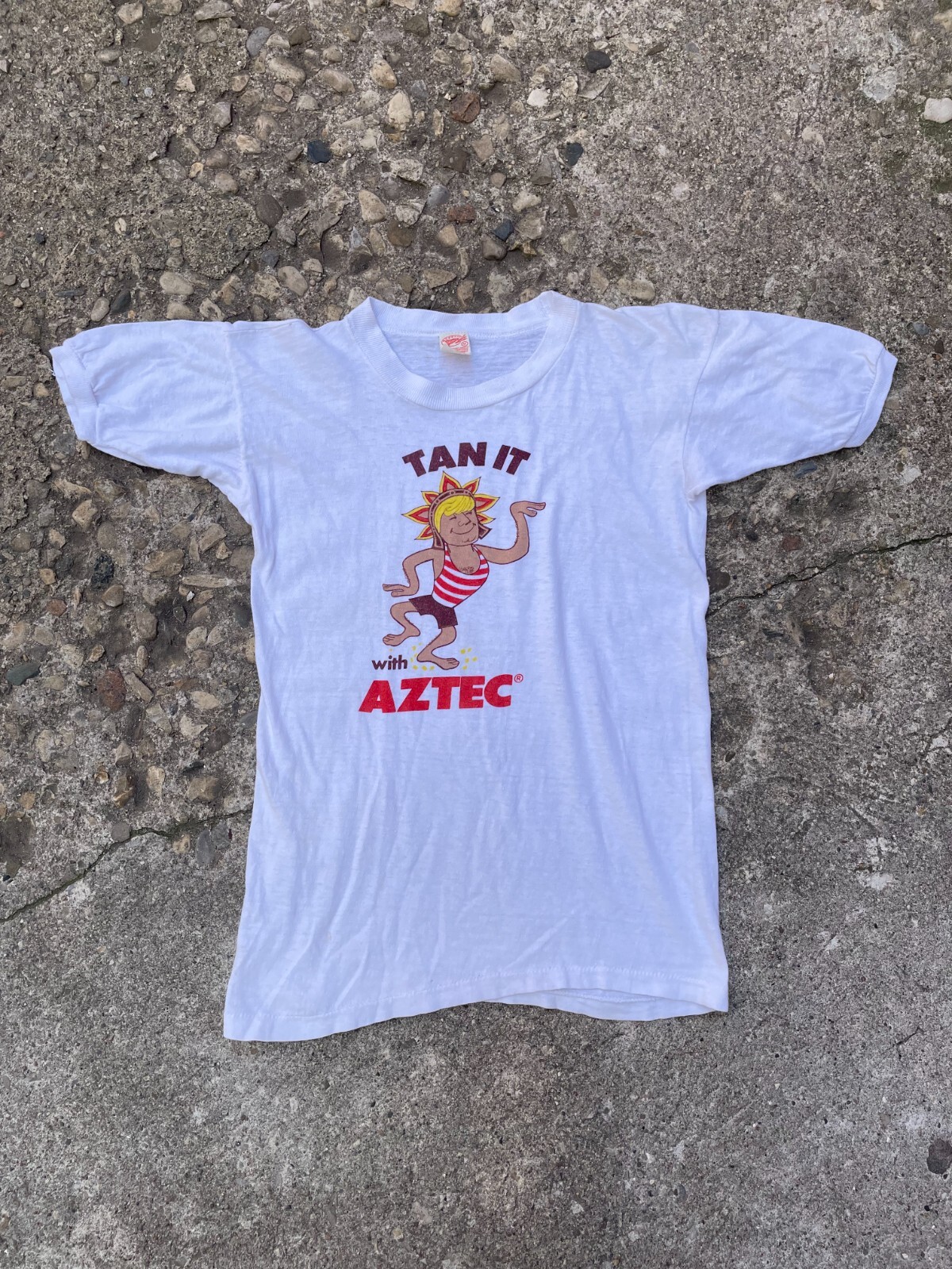 True Vintage 1960’s 'Tan It’ Aztec Sun Tan Lotion Graphic Ringer T-Shirt Size S