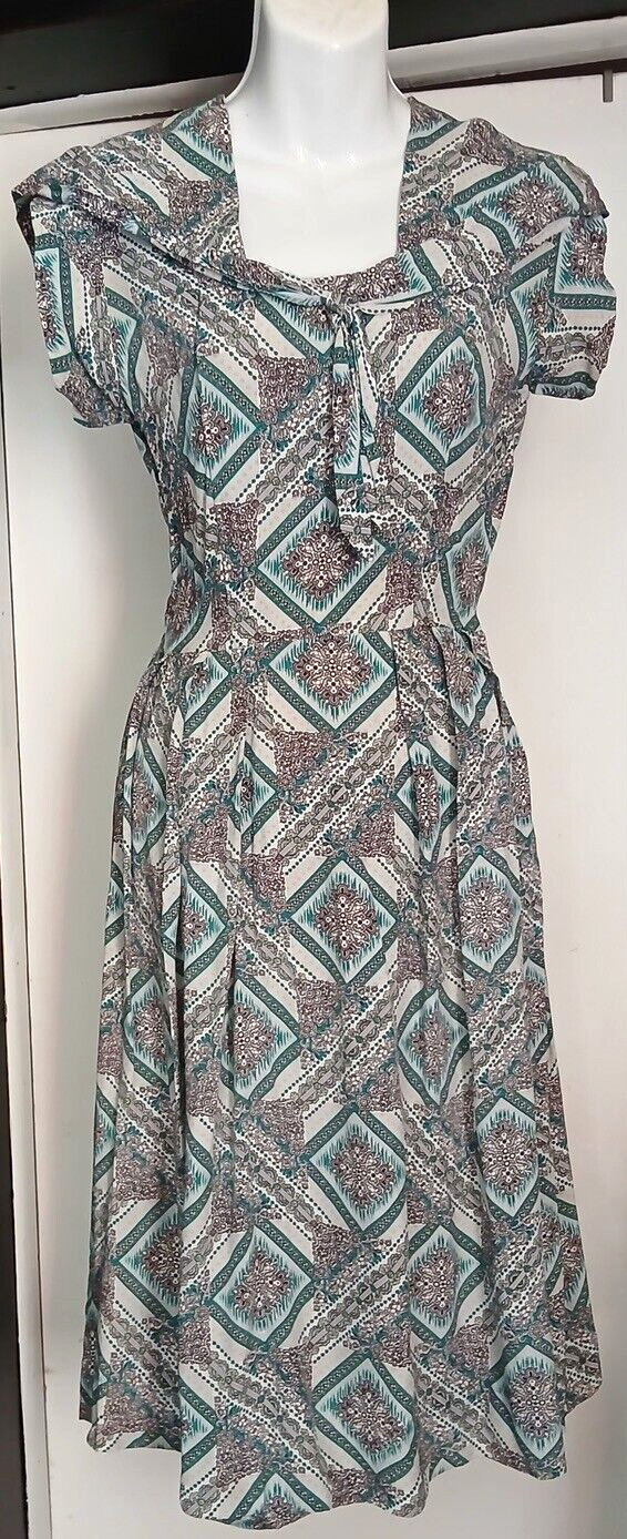 Unique & Flattering 40s handmade Rayon dress with cute tie around neck.Must See!