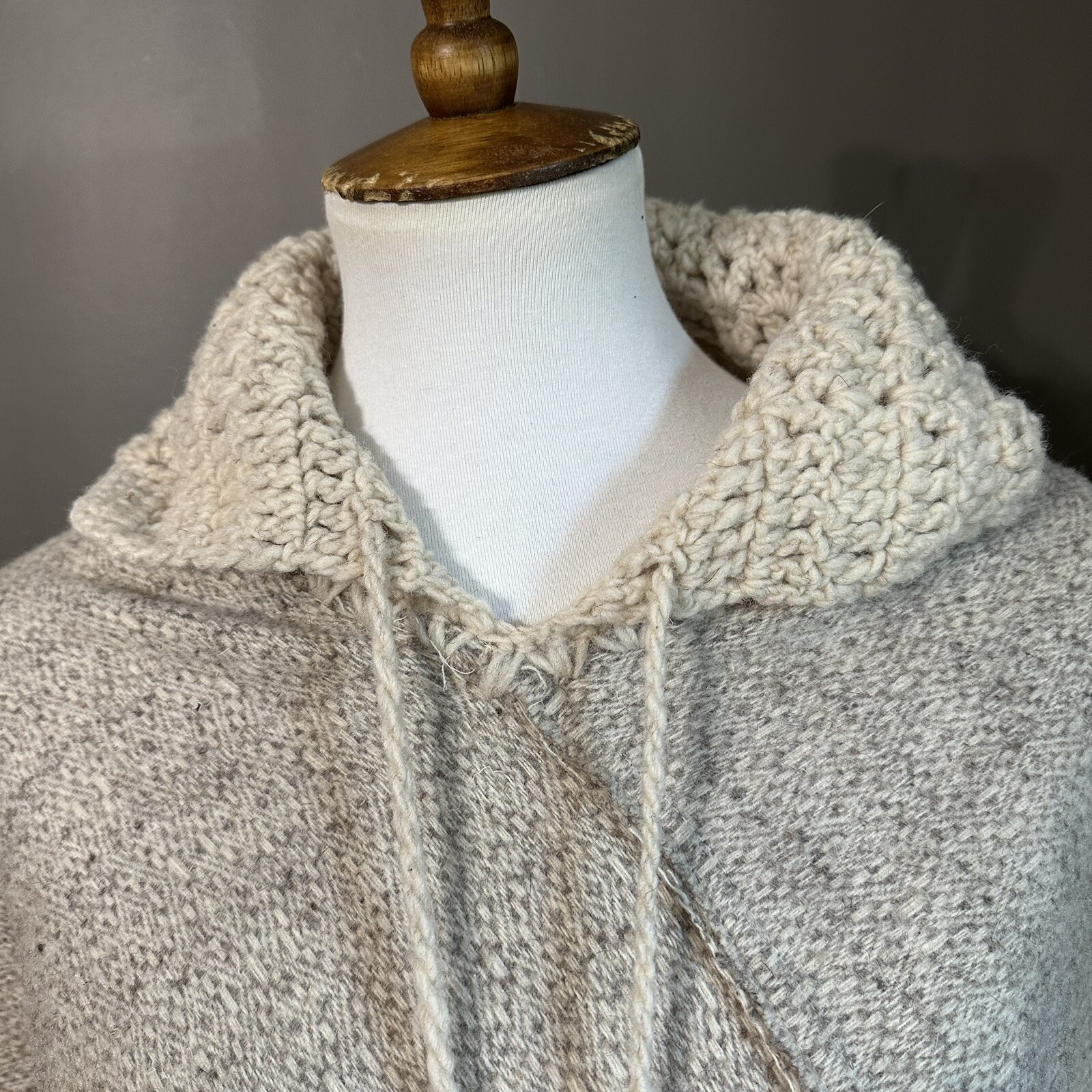 Vintage 1970s Soft and warm cream poncho with hood, tassels, and pom poms