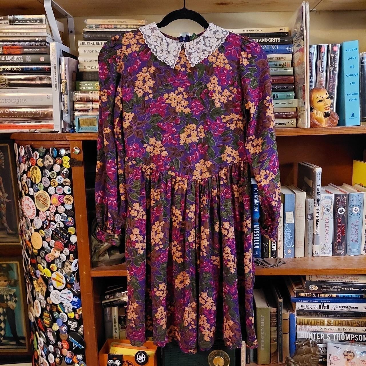 Vintage floral long sleeve dress with lace collar and bow detail.