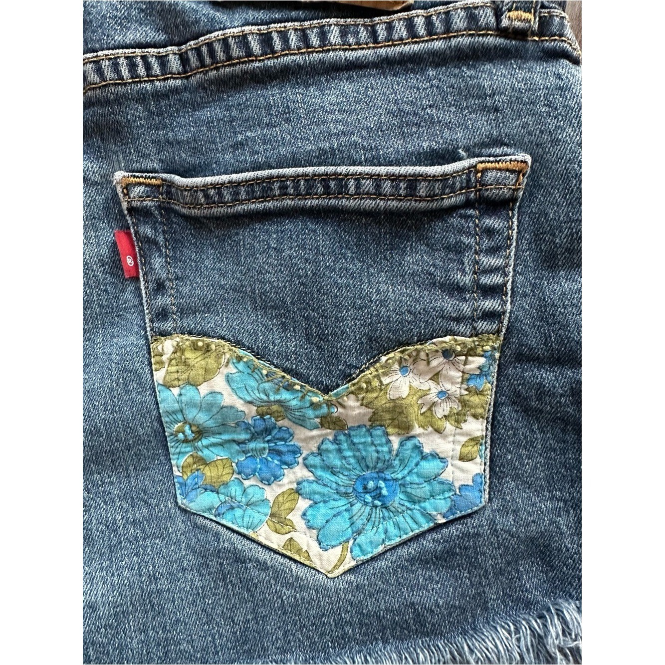 Upcycled Levi’s 511 Cut Off Shorts with Embroidered Pockets. Size 28; Runs Small